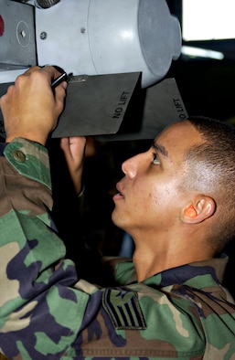 MISAWA AIR BASE, Japan -- Staff Sgt. Rolmir Garcia, 13th Aircraft Maintenance Unit, does a postload inspection to ensure the AIM 120 rear wings are locked in place during the annual Load Crew Competition here, Nov 30, 2007. Teams competing in the load crew competition are judged on speed, accuracy, and dress and appearance.
(US Air Force photo by Airman 1st Class Eric Harris)