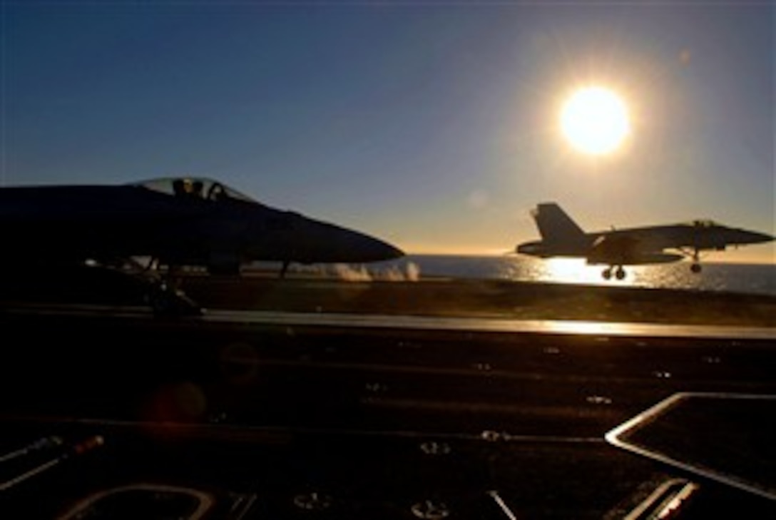 An F/A-18E Super Hornet assigned to the "Eagles" of Strike Fighter Squadron (VFA) 115 launches from catapult three on the flight deck of the Nimitz-class nuclear-powered aircraft carrier USS Ronald Reagan (CVN 76) while another F/A-18E Super Hornet waits its turn to launch during flight operations, Dec. 10, 2007. Reagan is currently underway conducting tailored ship's training assessment.