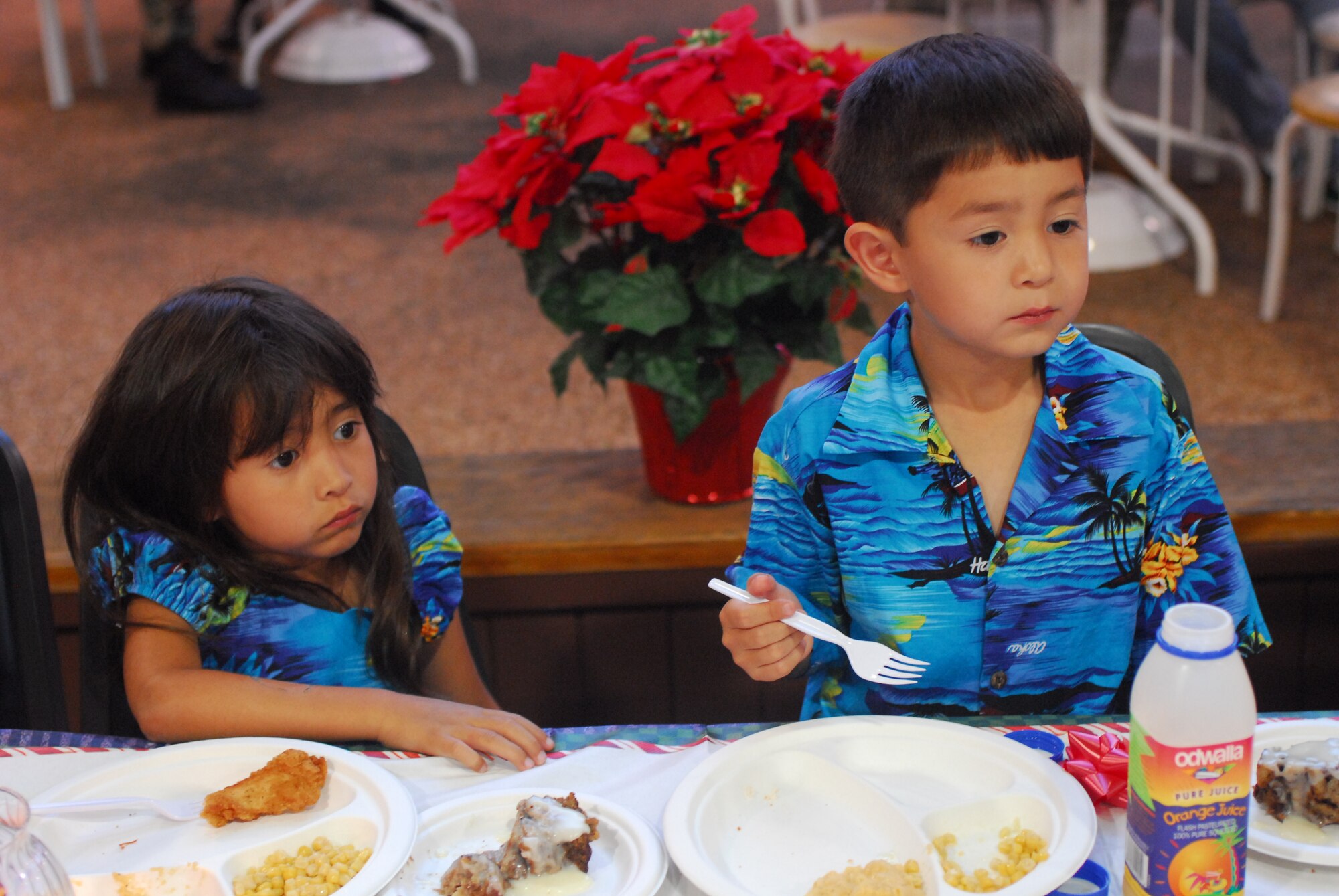 Mei, left, and Kai, right, enjoy the evening of food, games and crafts. (U.S. Air Force Photo by Staff Sgt. Erin Smith) 