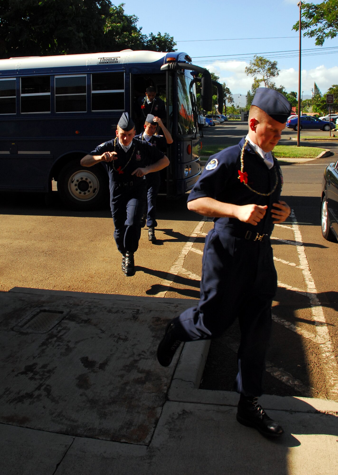 Tops In Blue members head into the Community Center for a reception after their arrival at Hickam. They were served light refreshments before heading to billeting. Photo by Staff Sgt. Erin Smith