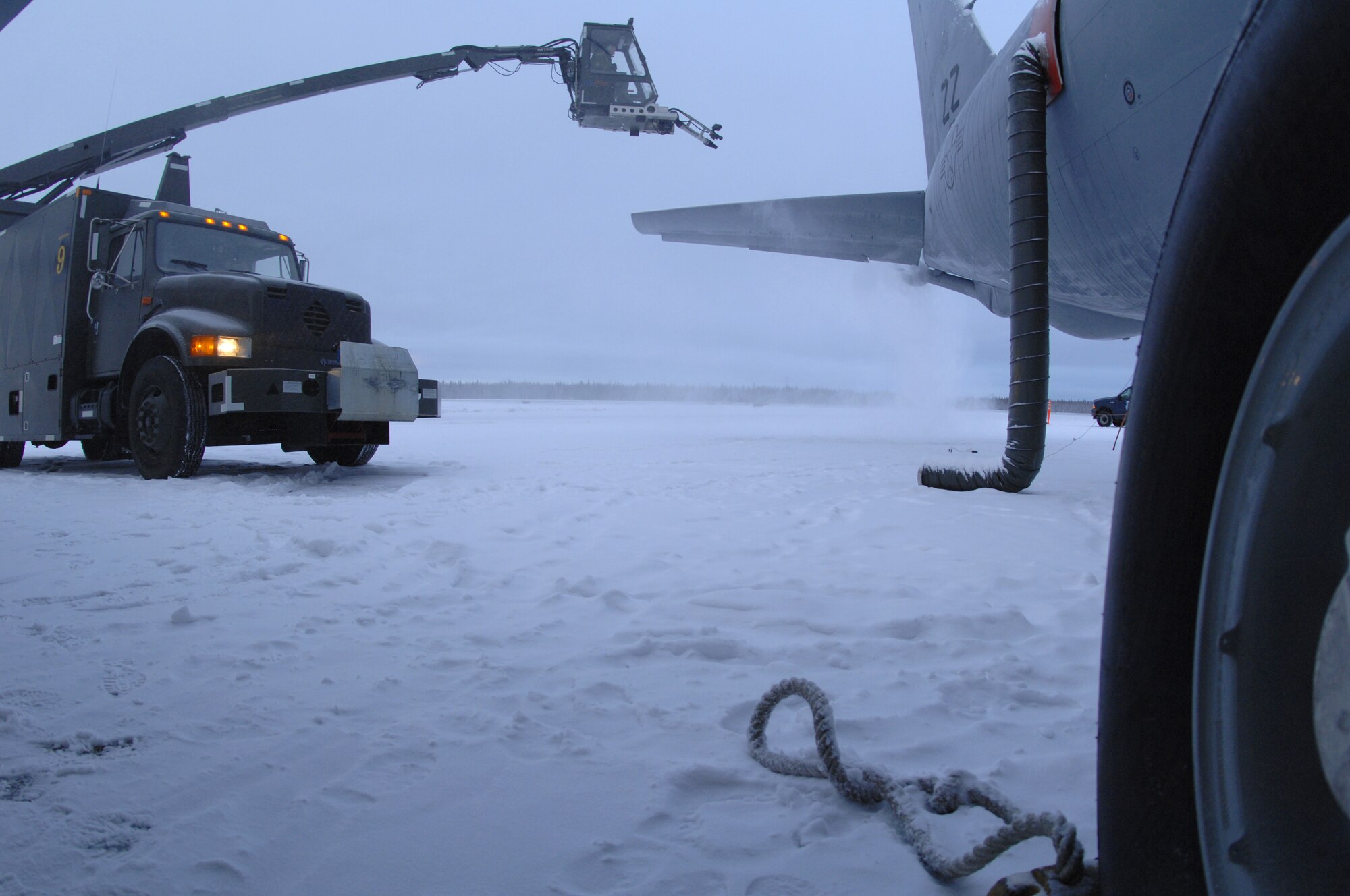 EIELSON AIR FORCE BASE, Alaska -- Snow is blown off the tail of a KC-135, part of the de-icing process Dec. 12, 2007 on the Eielson flightline. Due to the arctic conditions and the continuous snow fall during Alaska's extended winters, Eielson maintainers are on constant standby to assure all aircraft are ready for take-off at moment's notice. (U.S. Air Force photo by Airman 1st Class Christopher Griffin)