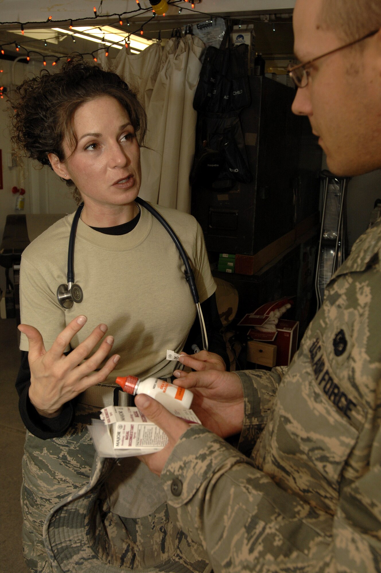 Physician Assistant Capt. Courtney Lee instructs a patient on when and how much medication to take for his cold Dec. 11in the 407th Expeditionary Medical Squadron Clinic at Ali Base, Iraq. Captain Lee is responsible for the care of Air Force personnel on base and is one of ten PAs who are emergency medicine certified. Captain Lee is deployed from Travis Air Force Base, Calif. (U.S. Air Force photo/Airman 1st Class Jonathan Snyder) 