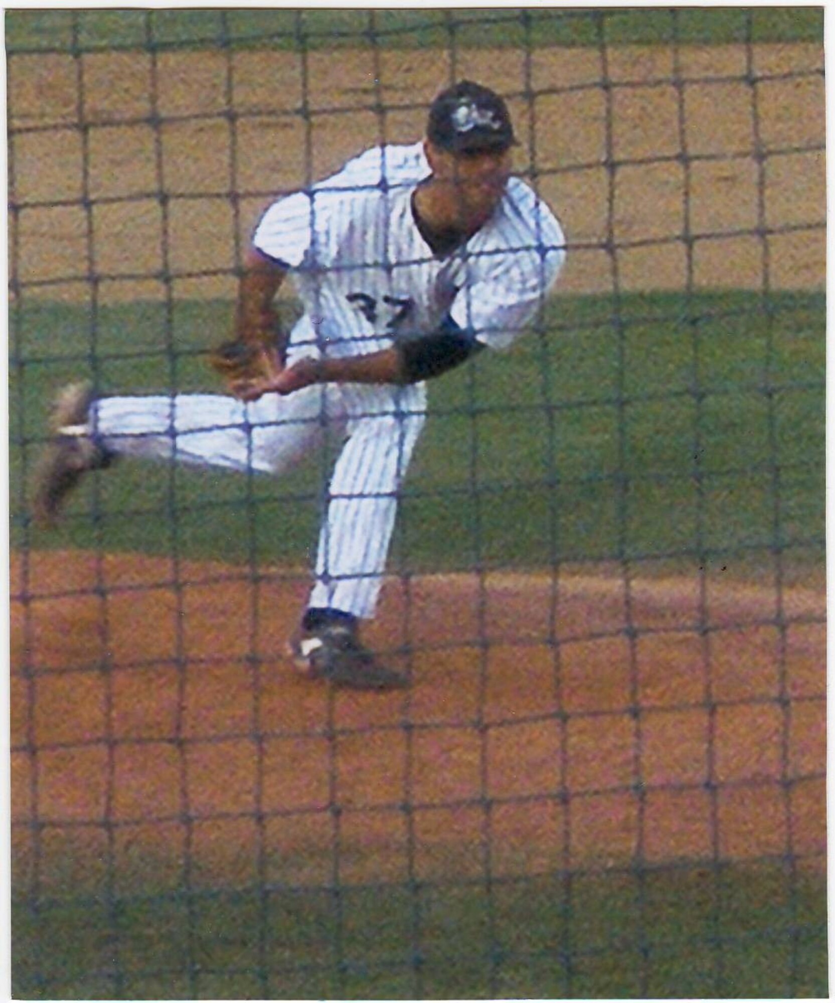 Ronnie Morales pitches at a Chicago White Sox baseball game this season.  He finished his first season with the Sox with an earned run average of 2.90, 32 strikeouts, and an overall team record of 27-10. (courtesy photo) 