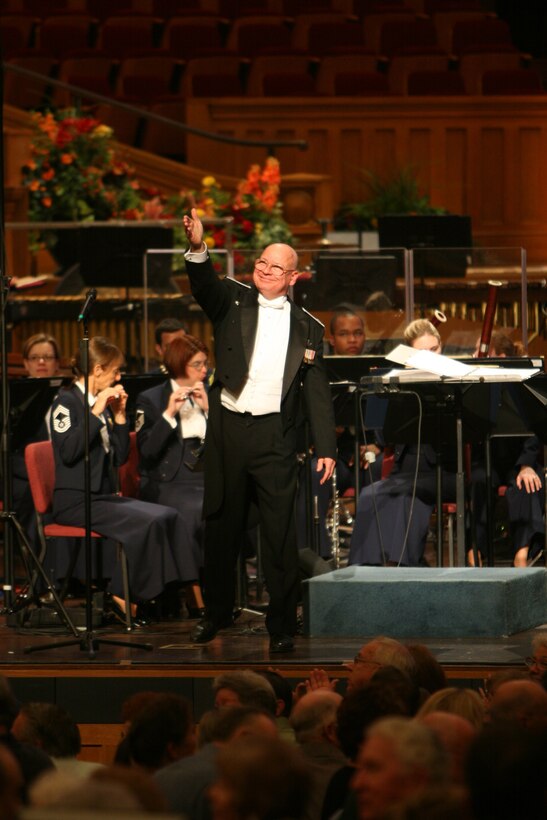 Colonel Dennis M Layendecker, Commander and Music Director of the United States Air Force Band, acknowledges the audience during a concert at the Mormon Tabernacle in Salt Lake City, Utah. (U.S. Air Force photo by SMSgt Robert Mesite) 

