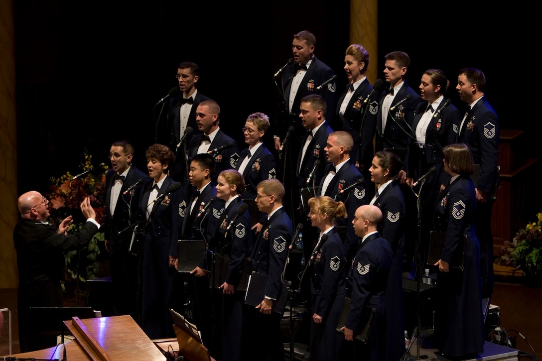 The USAF Band Singing Sergeants open up the second half of a concert at the Mormon Tabernacle in Salt Lake City, Utah, on their fall 2007 tour. Conducting the group is the Commander and Music Director of the USAF Band, Colonel Dennis M. Layendecker.  (U.S. Air Force photo by SMSgt Robert Mesite)