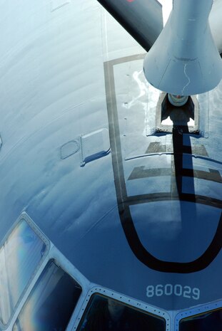 A Travis Air Force Base, Calif., KC-10 Extender receives fuel from a 940th Air Refueling Wing KC-135 Stratotanker. (Photo by Senior Airman George Cloutier)