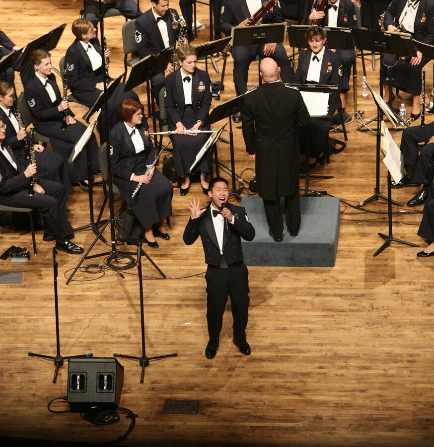 Technical Sgt Benjamin Park performs a solo with the United States Air Force Band at Weber State University in Ogden, Utah. Technical Sgt Park is a member of the Singing Sergeants, the official chorus of the United States Air Force.  (U.S. Air Force photo by SMSgt Robert Mesite)