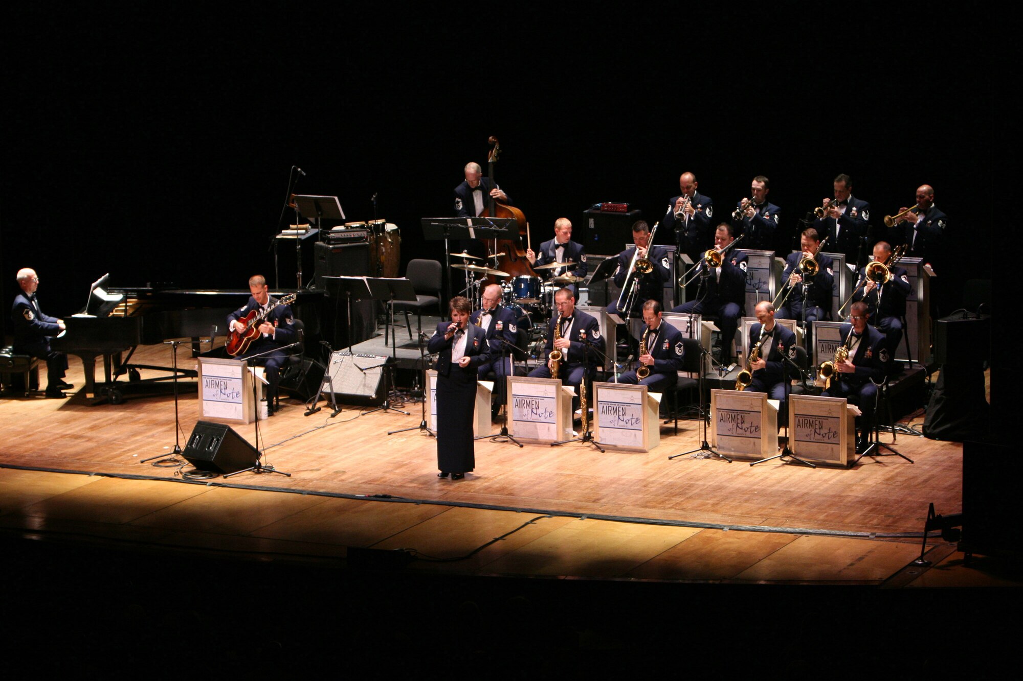 Technical Sgt Paige Martin singing with the Airmen of Note, the premier jazz ensemble of the United States Air Force, at Lisner Auditorium in Washington, D.C. during a 2007 Jazz Heritage Series concert.  (U.S. Air Force photo by SMSgt Robert Mesite)