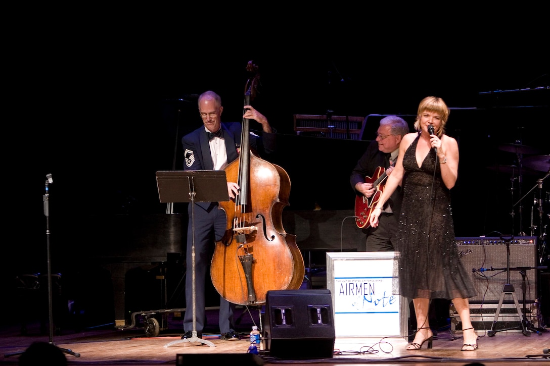 Jazz singer Karrin Allyson, guitarist Ron Fleeman and the United States Air Force Band's Airmen of Note bassist Senior Master Sgt Paul Henry perform a trio selection during the first 2007 Jazz Heritage Series at Lisner Auditorium on the campus of George Washington University, September 7, 2007, in Washington, DC.  (U.S. Air Force photo by SMSgt Robert Mesite)