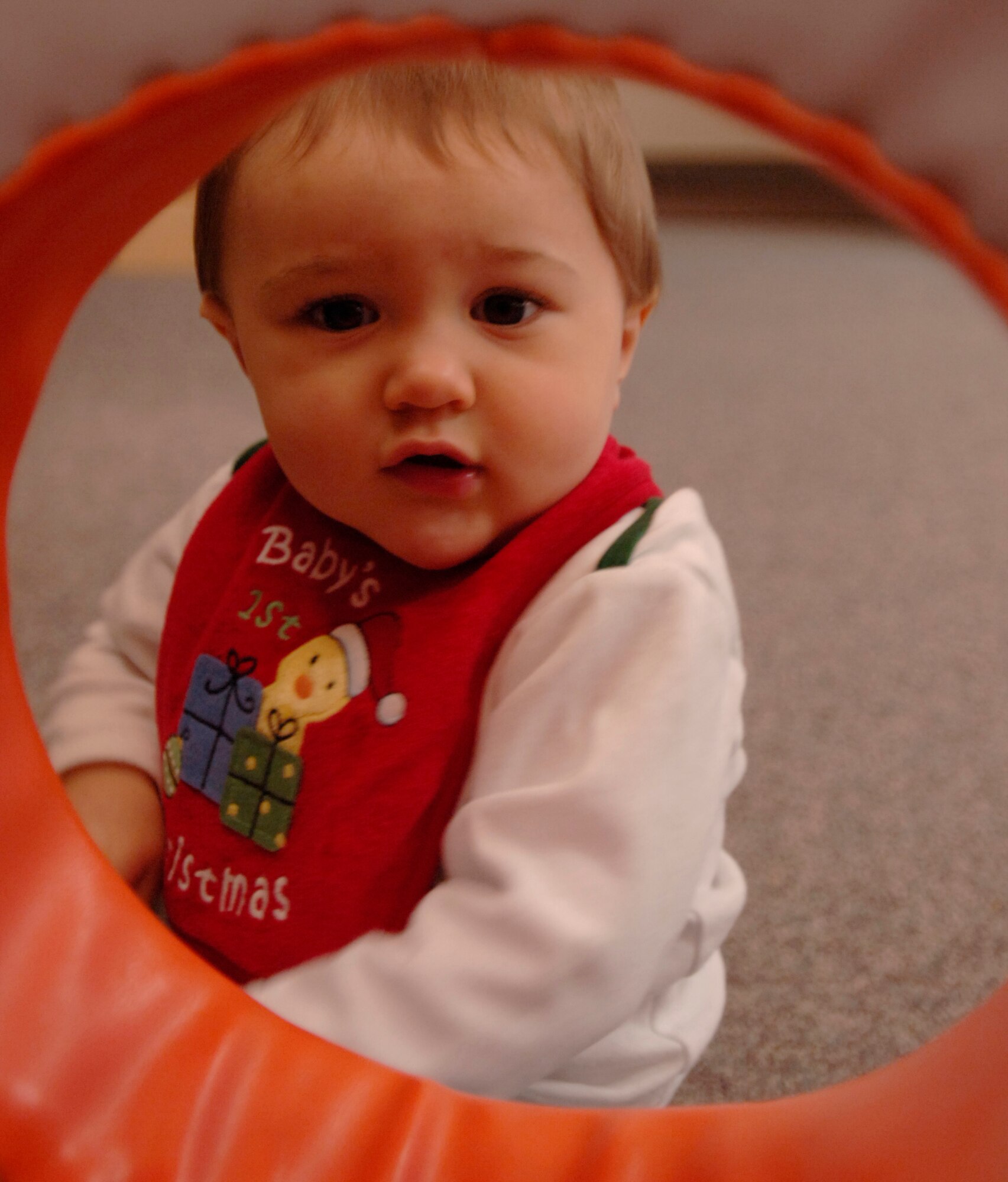 MCCONNELL AIR FORCE BASE, Kan. -- Troy Beaulieu, son of Tech. Sgt. Lucas Beaulieu, 22nd Aircraft Maintenance Squadron, plays hide-and-seek with his mother Tia Beaulieu Dec. 8 at the children’s playgroup building. The Hearts Apart program gives parents an opportunity to enjoy family-oriented activities while loved ones are deployed during the holidays. (Photo by Airman 1st Class Maria Ruiz)