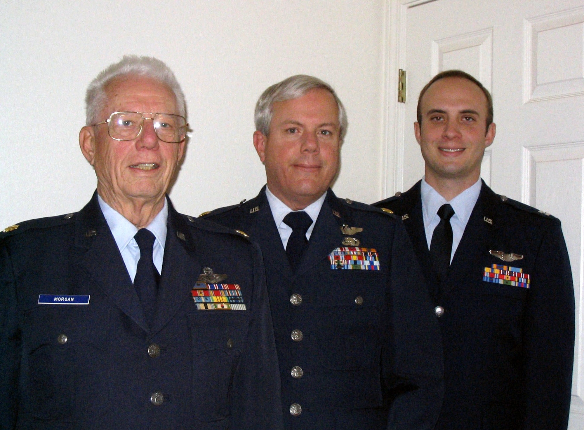 Retired Majs. David Morgan Jr. and Pat Morgan and Maj. David Morgan share three generations of Air Force stories and experiences.  All three members of the Morgan family -- grandfather, father and son -- have flown the C-130 Hercules.  (Courtesy photo)