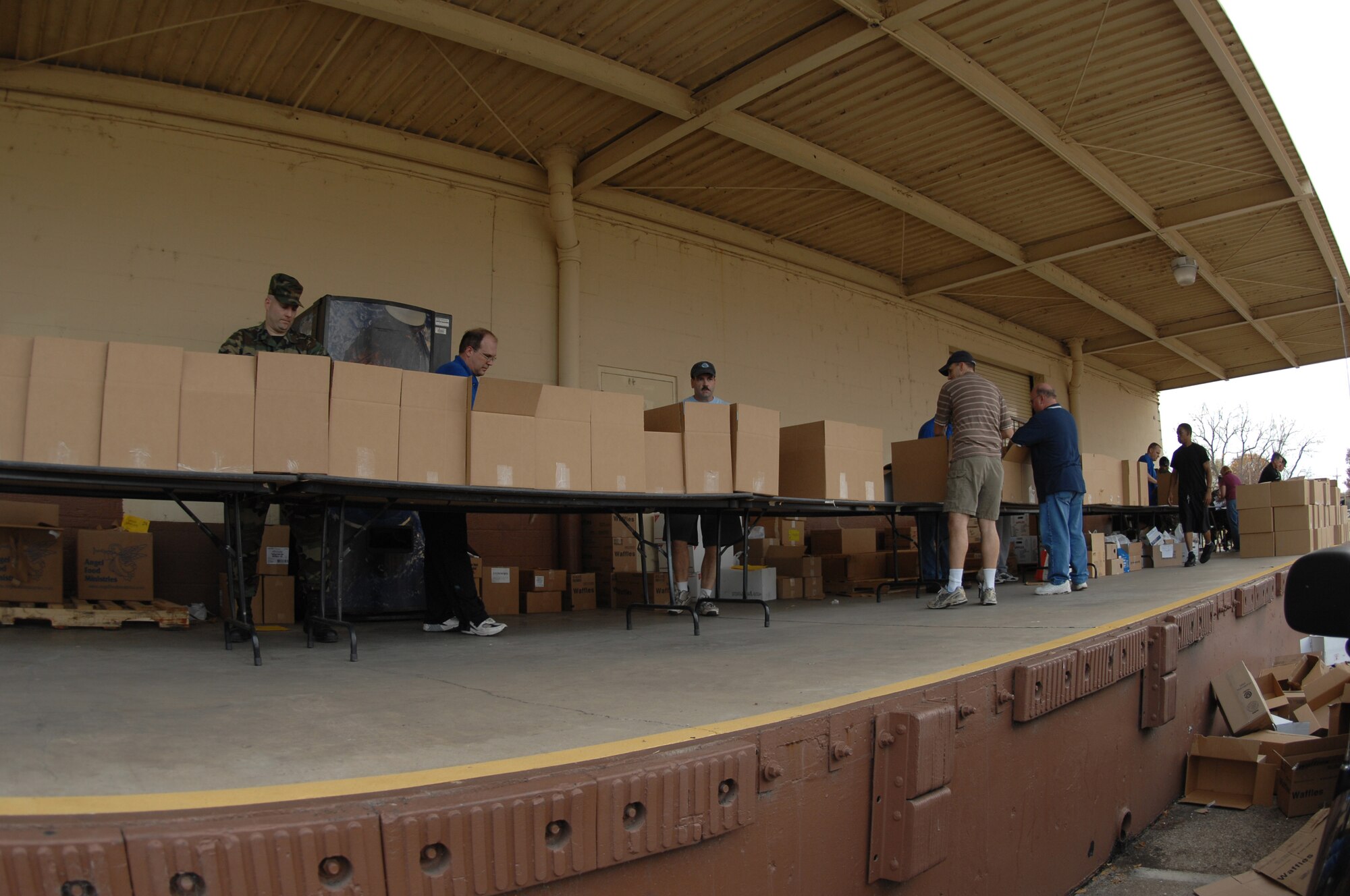 First Sergeants and volunteers assemble food boxes outside the 2nd Logistics Readiness Squadron warehouse at Barksdale Air Force Base, La., Dec. 11.   Angel Food Ministries visited Barksdale, for the first time, to deliver more than 220 boxes of food to Airmen and their families.(U.S. Air Force photo by Airman 1st Class Joanna M. Kresge)(Released)