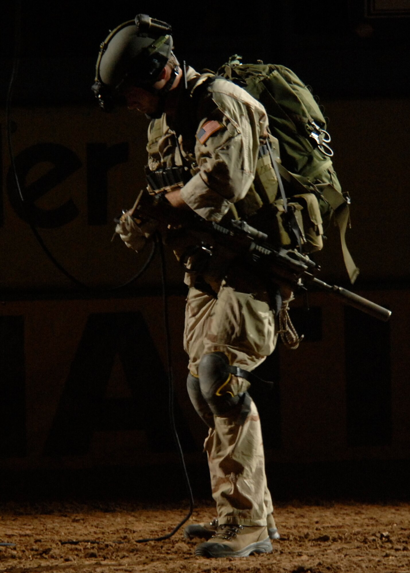 Staff Sgt. Kendrick Passey, 58th Rescue Squadron Pararescueman, unhooks himself from a rope after repelling down from the rafters, portraying a real life scenario of a downed pilot rescue at the opening ceremony during the National Finals Rodeo held at the Thomas & Mack Center, Las Vegas Nev.,  December 9, 2007. To commemorate the Air Force's 60th Anniversary, Nellis played mulitple roles in the NFR, to include a downed pilot rescue simulation, Thunderbird appearance, honor guard presentation, and also honored five medal recipients for their contributions in the Global War on Terror. The NFR is the premier championship rodeo event in the United States and is held each year during the first full week of December. 
(U.S Air Force Photo by Airman Stephanie Rubi)