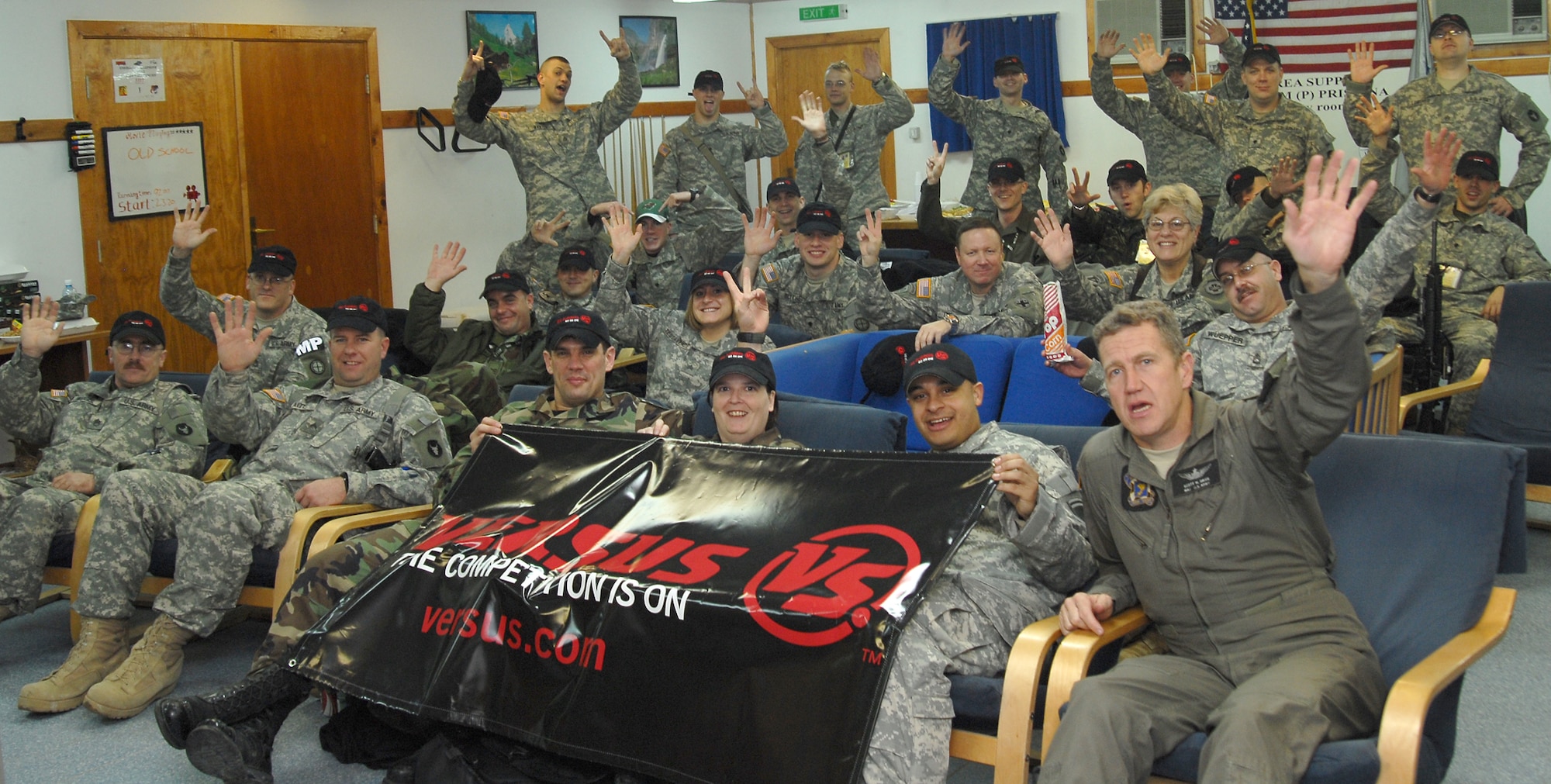 About 35 servicemembers gathered at Camp Film City's Morale, Welfare and Recreation Center at 1 a.m., Dec. 12, to watch the Pittsburgh Penguin and Philadelphia Flyer hockey broadcast on VERSUS, the National Cable Home of the National Hockey League. Pictures of American Soldiers, Airmen and Sailors who are currently deployed to Camps Film City and Bondsteel, Kosovo, were shown to a national television audience in the United States at the same time the troops were watching the live broadcast on the American Forces Network.  (Air Force photo by Tech. Sgt. Jason Smith)
