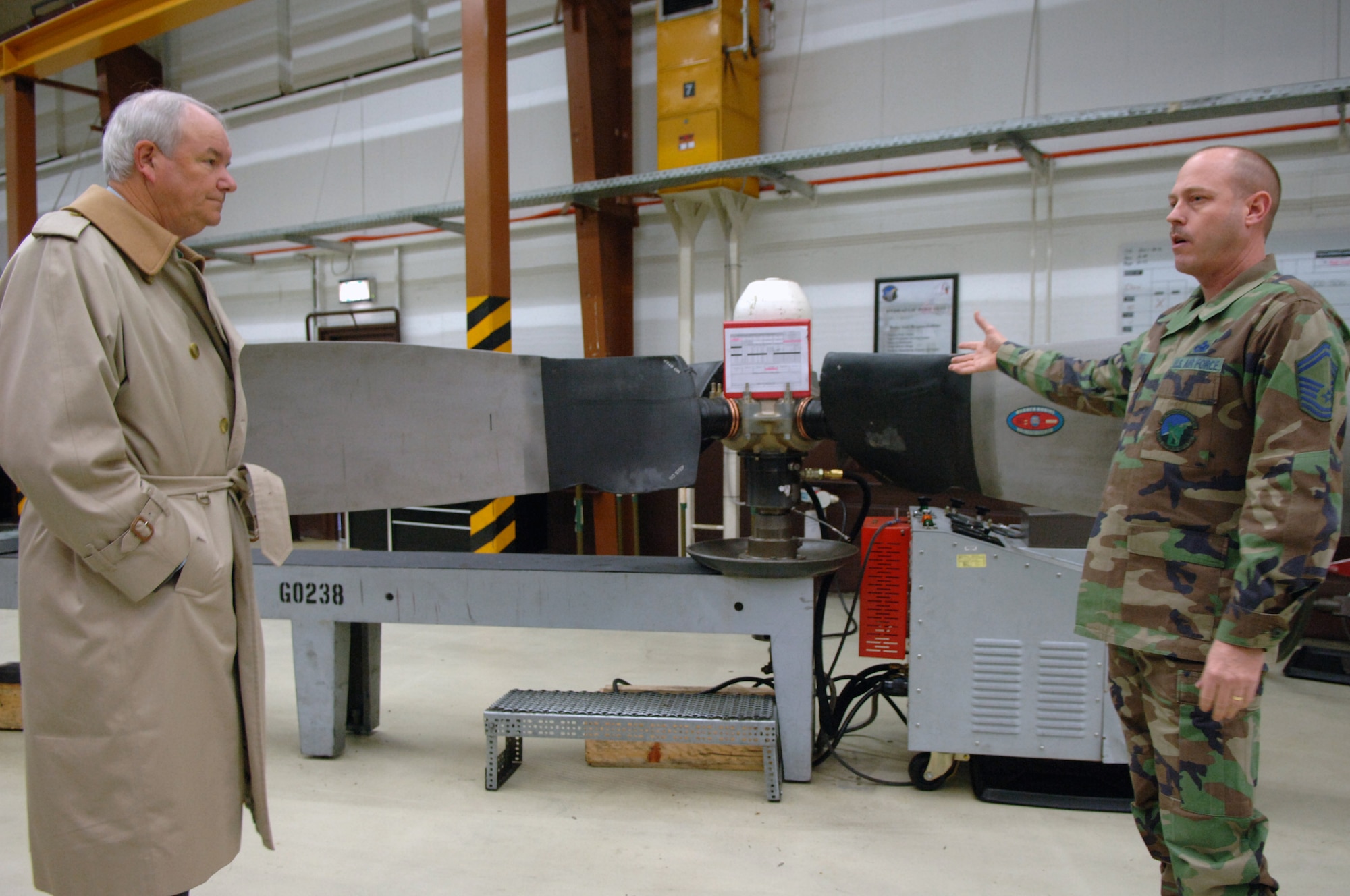 Senior Master Sgt. Phillip Arnts (right), 86th Maintenance Squadron, briefed Secretary of the Air Force Michael W. Wynne (left) on the new process to repair C-130 propellers.  The new cellular flow design was implemented as part of the Air Force Smart Operations for the 21st Century (AFSO21) program.  (U.S. Air Force Photo by Airman 1st Class Kelly LeGuillon)