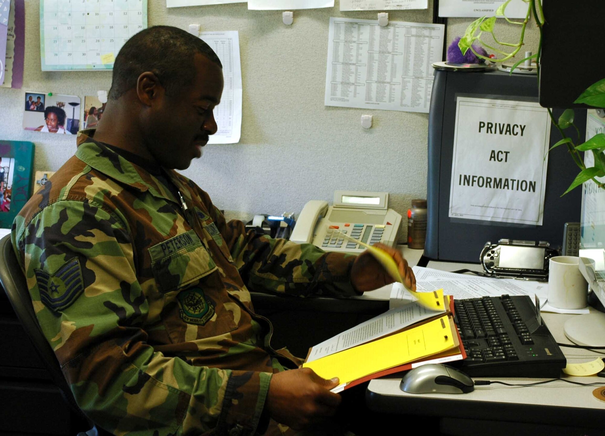 Tech. Sgt. Leo Peterson II, 60th Air Mobility Wing Military Equal Opportunity office, reviews a case recently at his desk. Sergeant Peterson has undergone training to prepare for his office’s merger with the Equal Employment Opportunity office. (U.S. Air Force photo/Nick DeCicco)


