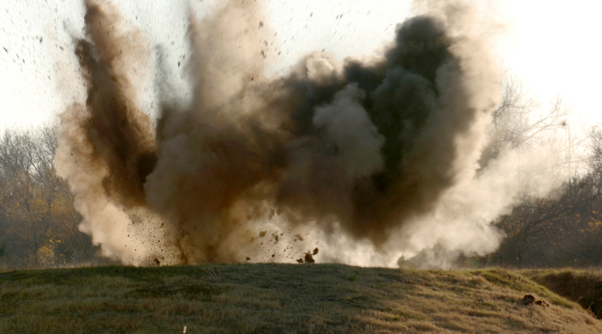 MCCONNELL AIR FORCE BASE, Kan. -- Explosive ordinance is detonated behind the Combat Arms Range on Nov. 19.  C-4 caused the detonation of the ordinance which is a common variety of military plastic explosive.  (Photo by Airman 1st Class Roy Lynch III)