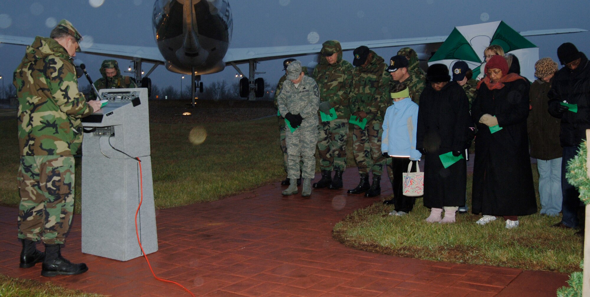MCCONNELL AIR FORCE BASE, Kan. -- Chaplain (Lt. Col.) Michael Williams, 22nd Air Refueling Wing, Chaplain Service team, leads the holiday tree lighting ceremony invocation by the front gate on Dec. 7. The tree lighting was held by the Chapel and the reception was held at the Chapel Annex.  (Photo by Airman 1st Class Maria Ruiz)