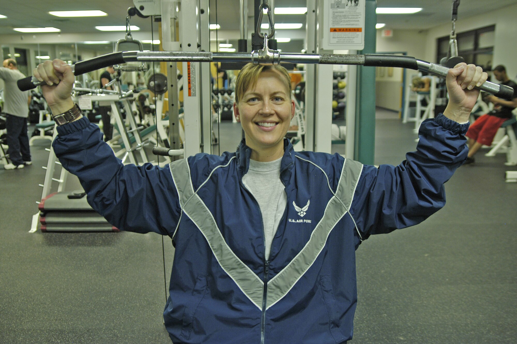 Maj. Karen Rader, prepares for the Biggest Winner contest through exercise at the Fitness Center Tuesday evening. (U.S. Air Force photo/Airman Shen-Chia Chu)                                                   