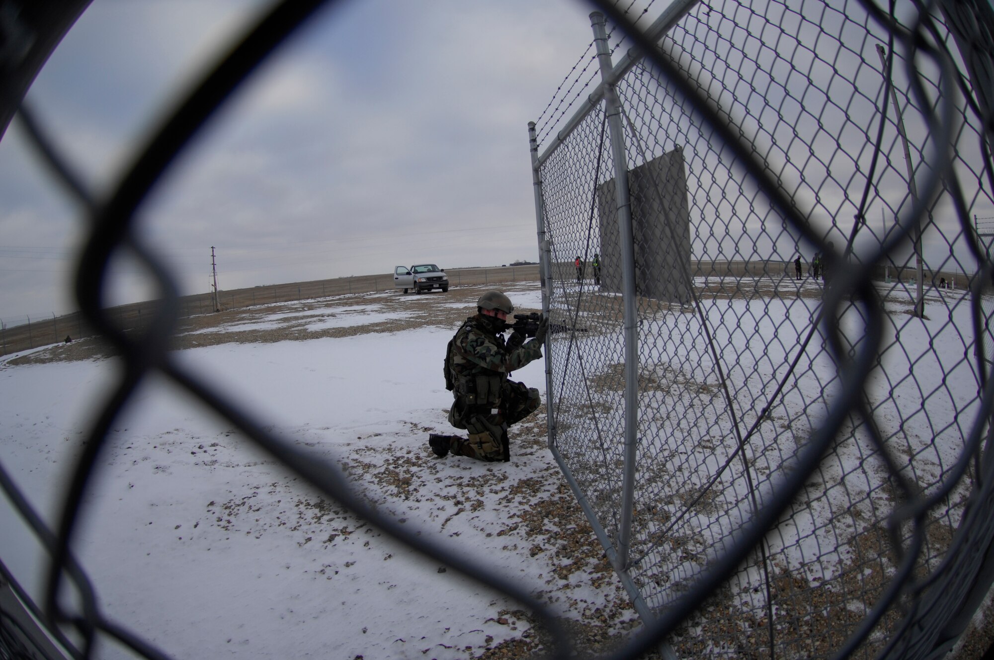 MINOT AIR FORCE BASE N.D. – Senior Airman Raif Kempf, 791st Missile Security Forces Squadron, tactical response force member, provides security to prevent entry into a Launch Facility during a recap exercise Dec. 11. The recap exercise tests the 91st Security Forces Group’s Airmen on their ability to recapture control of a launch facility. (U.S. Air Force photo by Airman First Class Joe Rivera)