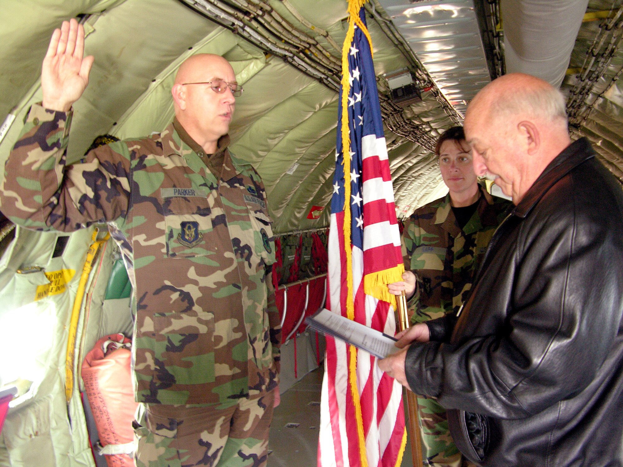 SEYMOUR JOHNSON AIR FORCE BASE, N.C.--Master Sgt. Dave A. Parker, from the 916th Aircraft Maintenance Squadron, reenlists aboard a KC-135 Stratotanker here, December 5. Senior Airman Charlene L. Kapp and Lt.Col. Donald I. Jackson (ret.), performed the ceremony.
Sergeant Parker has been with the 916th Air Refueling Wing since December, 1986.
This is Sergeant Parker's last reenlistment before he retires.
