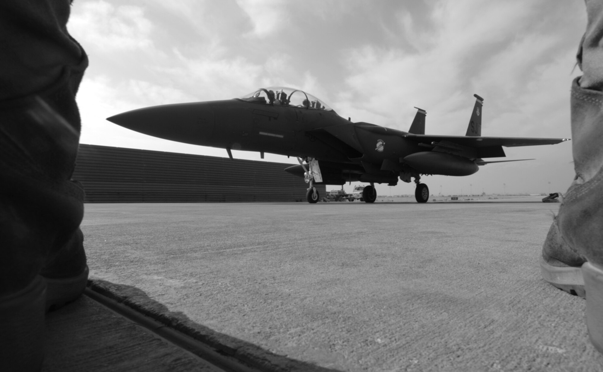 BAGRAM AIR BASE, Afghanistan - An F-15E crew chief stands ready to marshal his plane out for take off, Dec. 7, 2007.  (U.S. Air Force photo/Staff Sgt. Joshua T Jasper)  (Released)