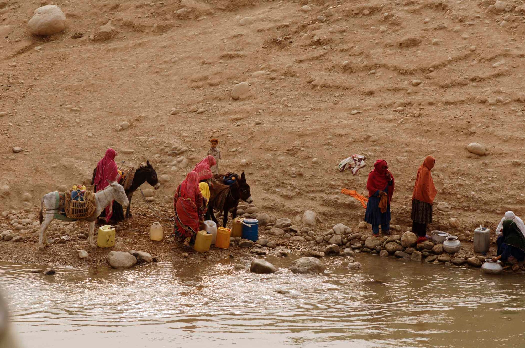 NANGARHAR PROVINCE, Afghanistan - Local villagers gather water from a canal in Afghanistan, Nov. 10, 2007. (U.S. Air Force photo by Staff Sgt. Joshua T. Jasper)(Released)
