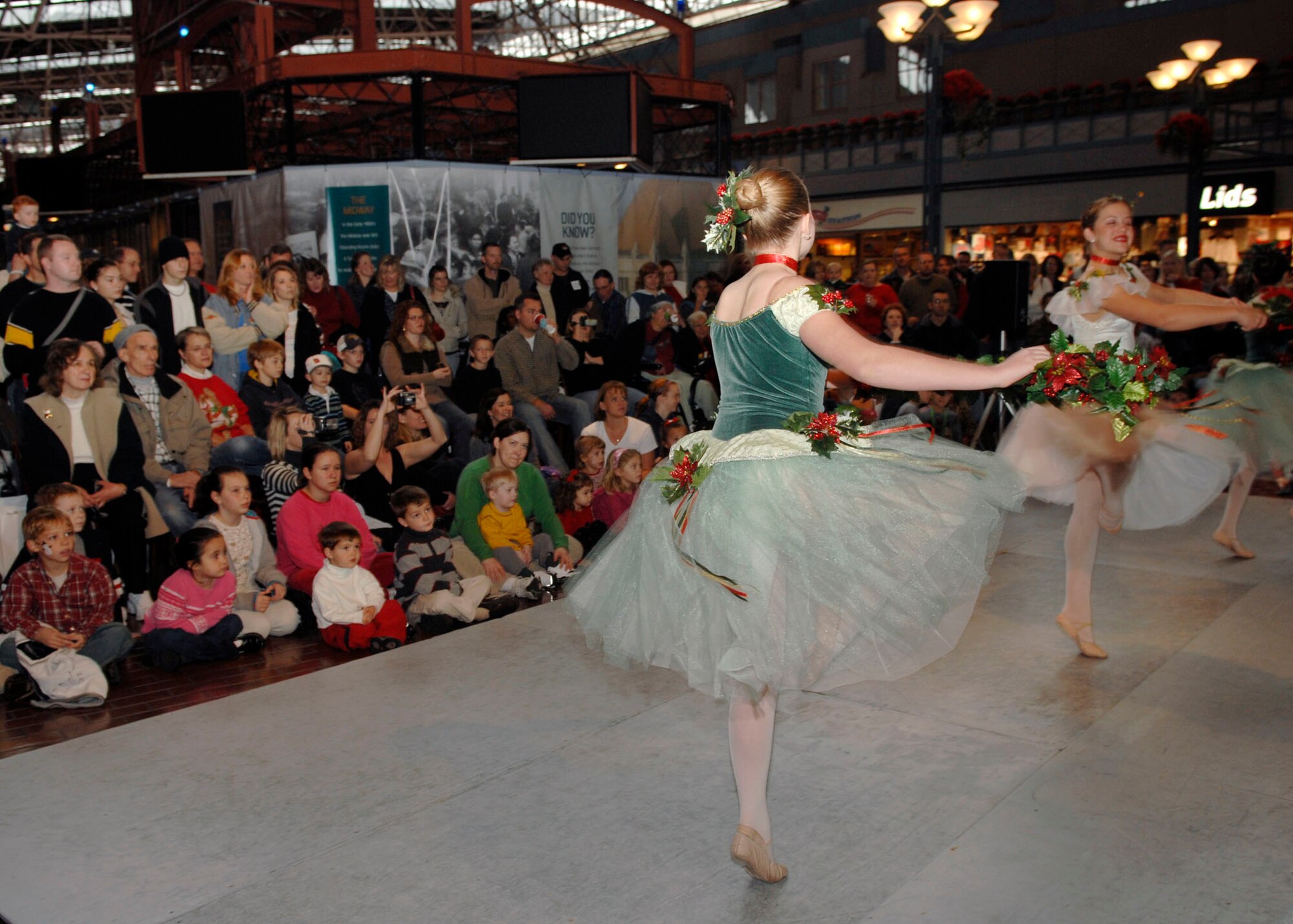 Fox Theater dancers entertain servicemembers and their families during the USO Santa Express at Union Station Dec. 8. (U.S. Air Force photo by Airman 1st Class Megan Gilliand)