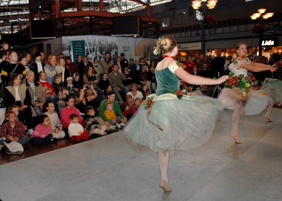 Fox Theater dancers entertain servicemembers and their families during the USO Santa Express at Union Station Dec. 8. (U.S. Air Force photo by Airman 1st Class Megan Gilliand)