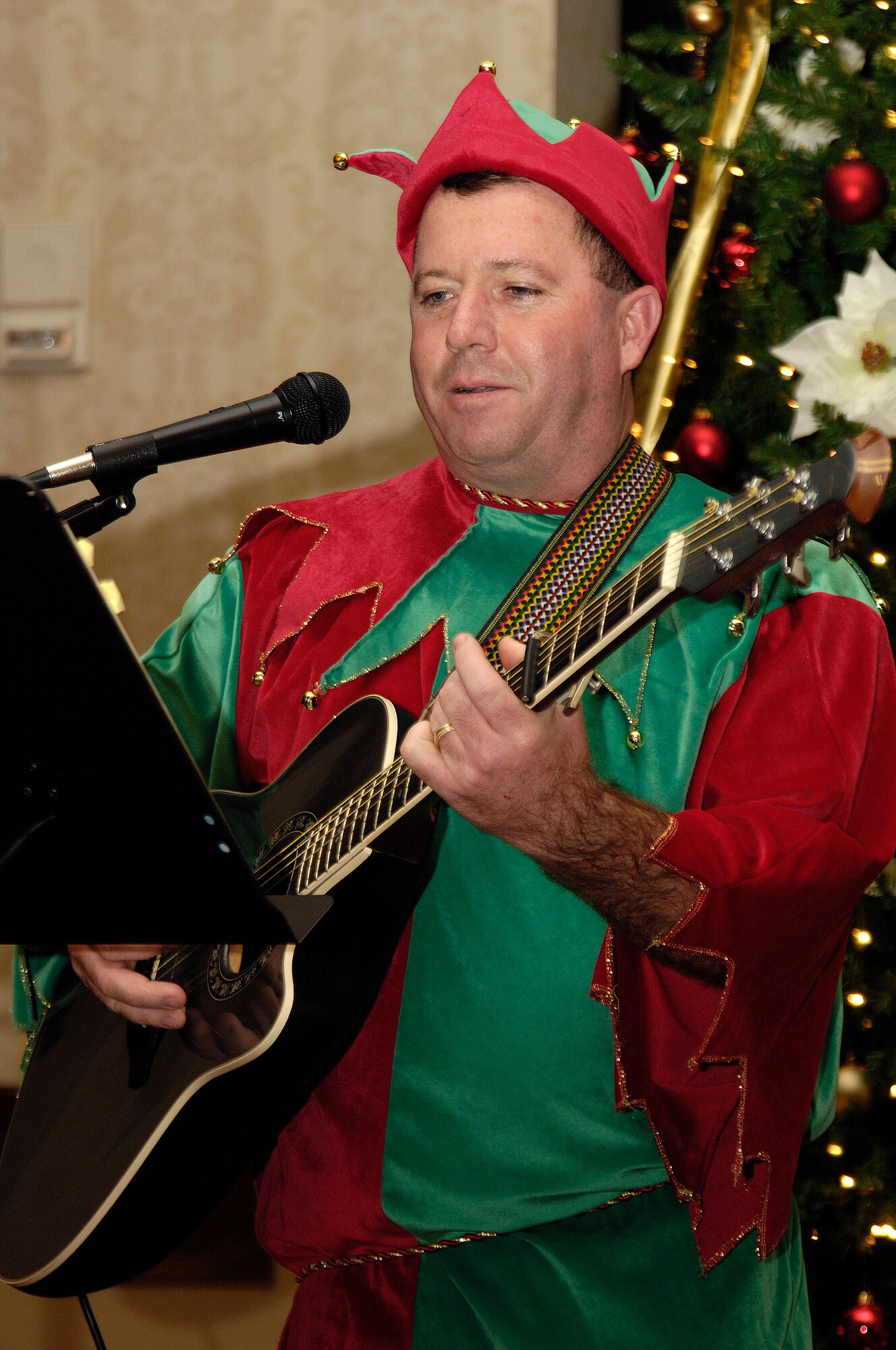 SCOTT AIR FORCE BASE, Ill. -- This holiday season Joint Total Force Scott started to celebrate in a variety of ways. Events kicked off with the USO and Jack Daniels Distillery “Toast to the Troops” concert on Dec. 4 featuring country music star Craig Morgan. Mr. Morgan along with more than a hundred Joint Total Force Scott members stuffed more than 10,000 USO care packages for deployed servicemembers. Joint Total Force Scott came out Thursday and braved the rain and snow to give out nearly 300 free holiday trees and to light the Scott tree. Saturday’s events started with the USO Santa Express event at Union Station in downtown St. Louis, which featured a free ride on the MetroLink and holiday activities for local military families, and ended with the 375th Airlift Wing Holiday party held at the Scott Club. The holiday season has just started for Joint Total Force Scott with many more events to come for more information on holiday events around Scott see upcoming issues of the Command Post. (U.S. Air Force photo by Marv Lynchard)