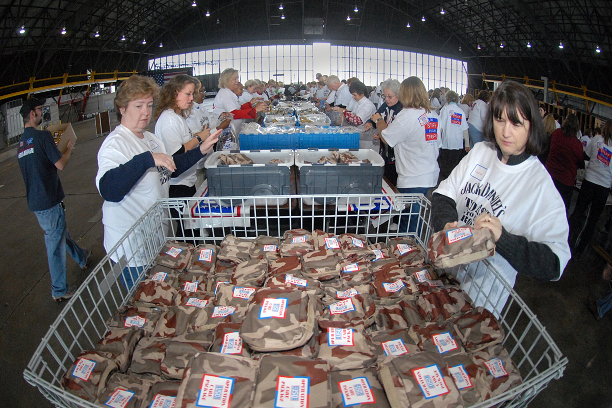 SCOTT AIR FORCE BASE, Ill. -- This holiday season Joint Total Force Scott started to celebrate in a variety of ways. Events kicked off with the USO and Jack Daniels Distillery “Toast to the Troops” concert on Dec. 4 featuring country music star Craig Morgan. Mr. Morgan along with more than a hundred Joint Total Force Scott members stuffed more than 10,000 USO care packages for deployed servicemembers. Joint Total Force Scott came out Thursday and braved the rain and snow to give out nearly 300 free holiday trees and to light the Scott tree. Saturday’s events started with the USO Santa Express event at Union Station in downtown St. Louis, which featured a free ride on the MetroLink and holiday activities for local military families, and ended with the 375th Airlift Wing Holiday party held at the Scott Club. The holiday season has just started for Joint Total Force Scott with many more events to come for more information on holiday events around Scott see upcoming issues of the Command Post. (U.S. Air Force photo by Marv Lynchard)