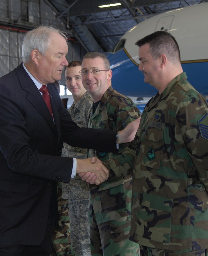 Hon. Michael W. Wynne, Secretary of the Air Force, shakes hands with Master Sgt. Bernard Smith, 89th Maintenance Group, during his visit to Andrews Dec. 4. The Secretary of the Air Force spent the day touring the 89th Airlift Wing as part of an official visit. (US Air Force/A1C Renae Kleckner)