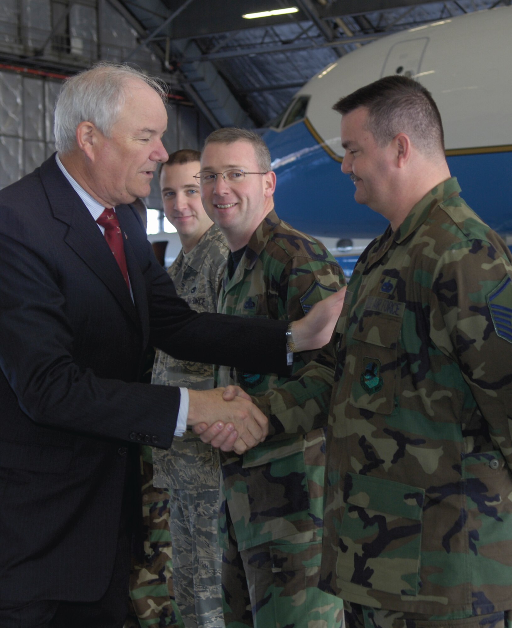 Hon. Michael W. Wynne, Secretary of the Air Force, shakes hands with Master Sgt. Bernard Smith, 89th Maintenance Group, during his visit to Andrews Dec. 4. The Secretary of the Air Force spent the day touring the 89th Airlift Wing as part of an official visit. (US Air Force/A1C Renae Kleckner)