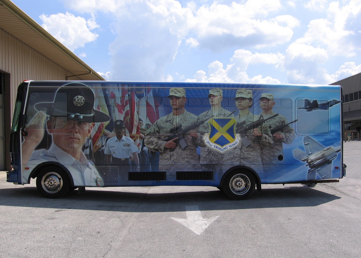 A bus used mostly for distinguished visitor tours on Lackland Air Force Base sports a shrink-wrapped picture of a military training instructor leading a group of trainees. The process of decorating a bus with a shrink-wrapped photo can take up to two weeks, depending on the design.