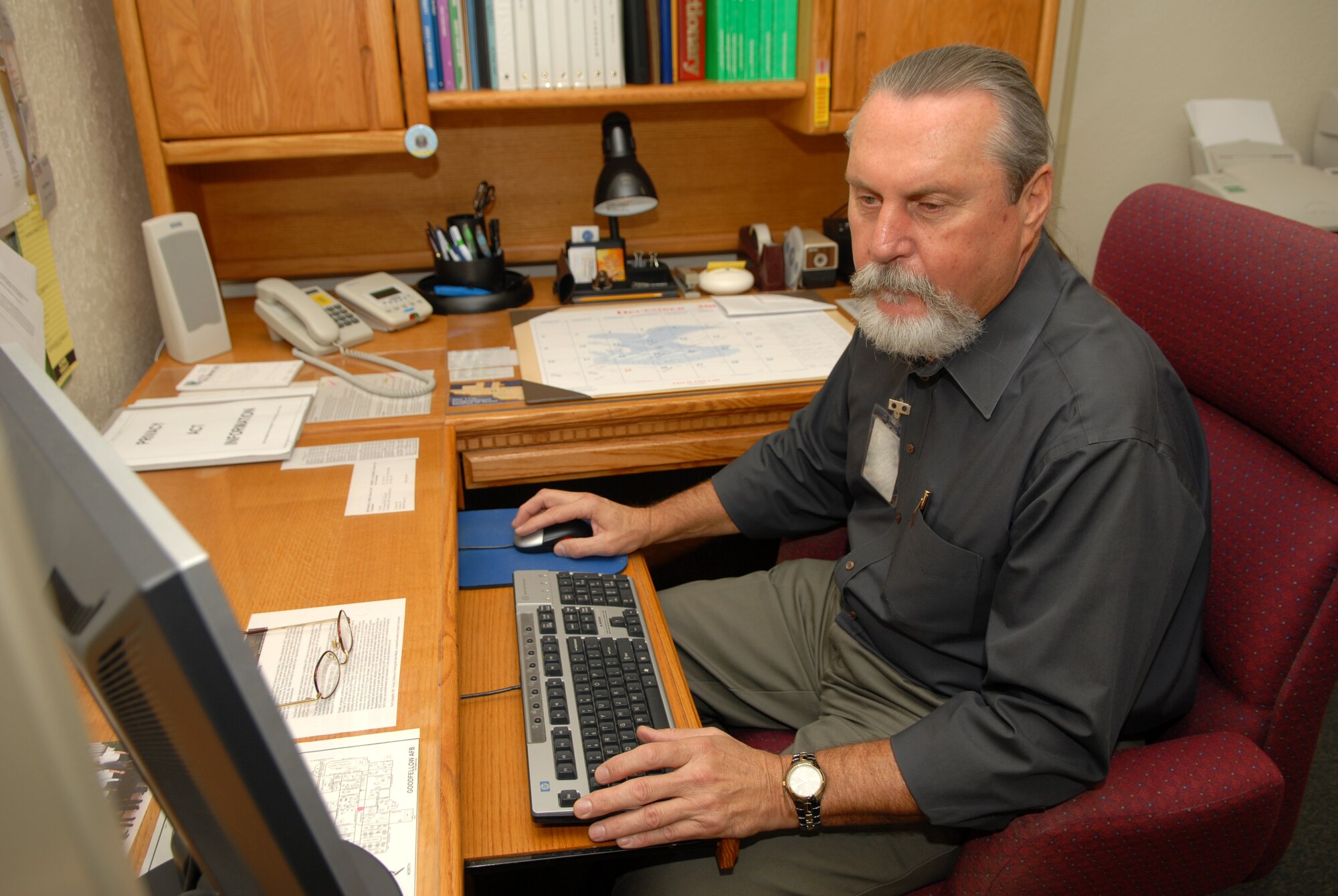 Ken Stenzel, 17th Training Wing equal employment manager, works in the 17 TRW Equal Employment Opportunity office Wednesday. The 17 TRW EEO office was awarded the AETC 2007 Alternate Dispute Resolution Award in the small organization category. (U.S. Air Force photo by Staff Sgt. John Barton)