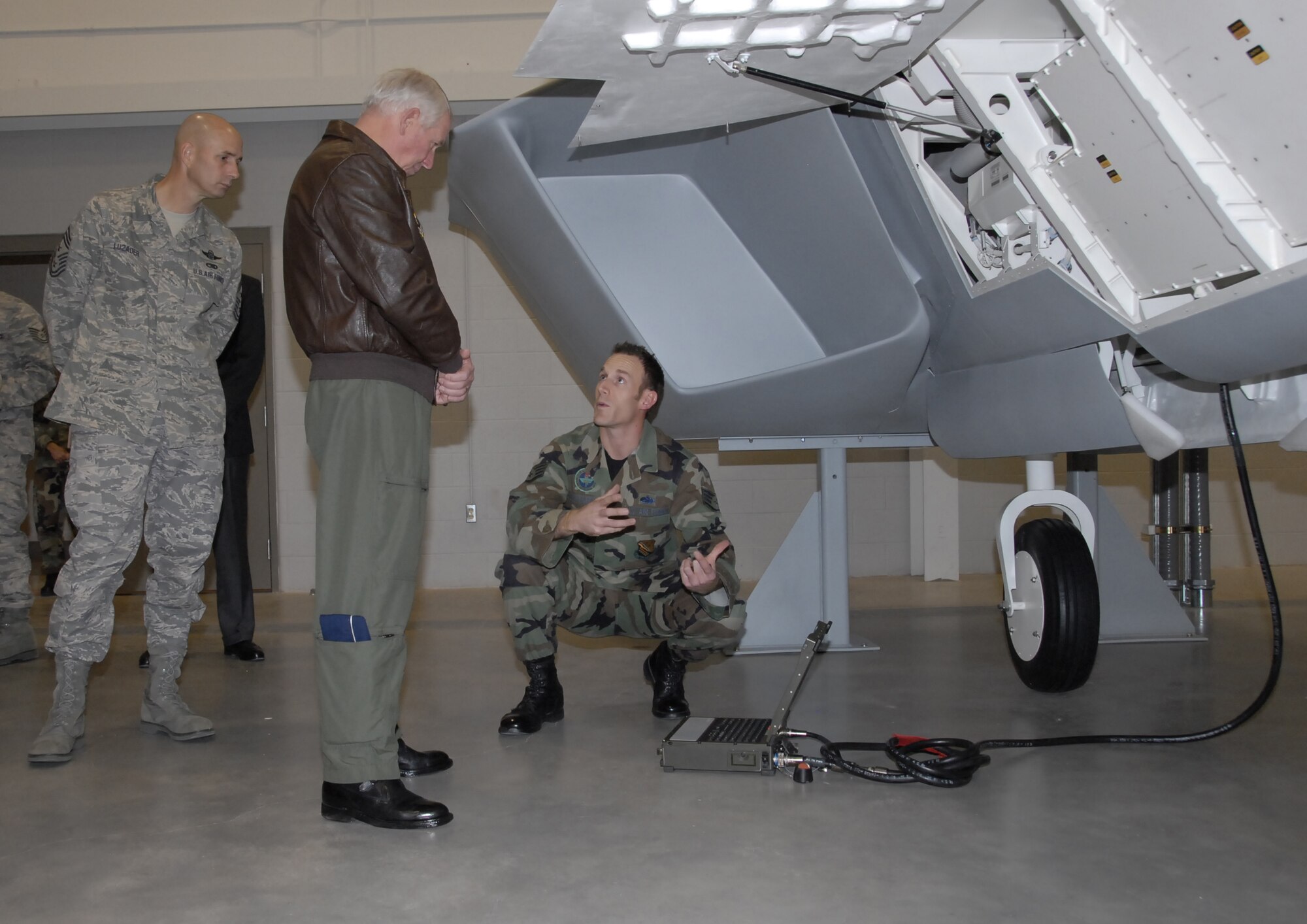 Gen. William R. Looney III, Air Education and Training Commander, and Chief Master Sgt. Mark R. Luzader, AETC command chief master sergeant, tour the new F-22 Raptor Maintenance Training Facility during the general's visit to Sheppard Nov. 29-30. (U.S. Air Force photo/Mike Litteken)