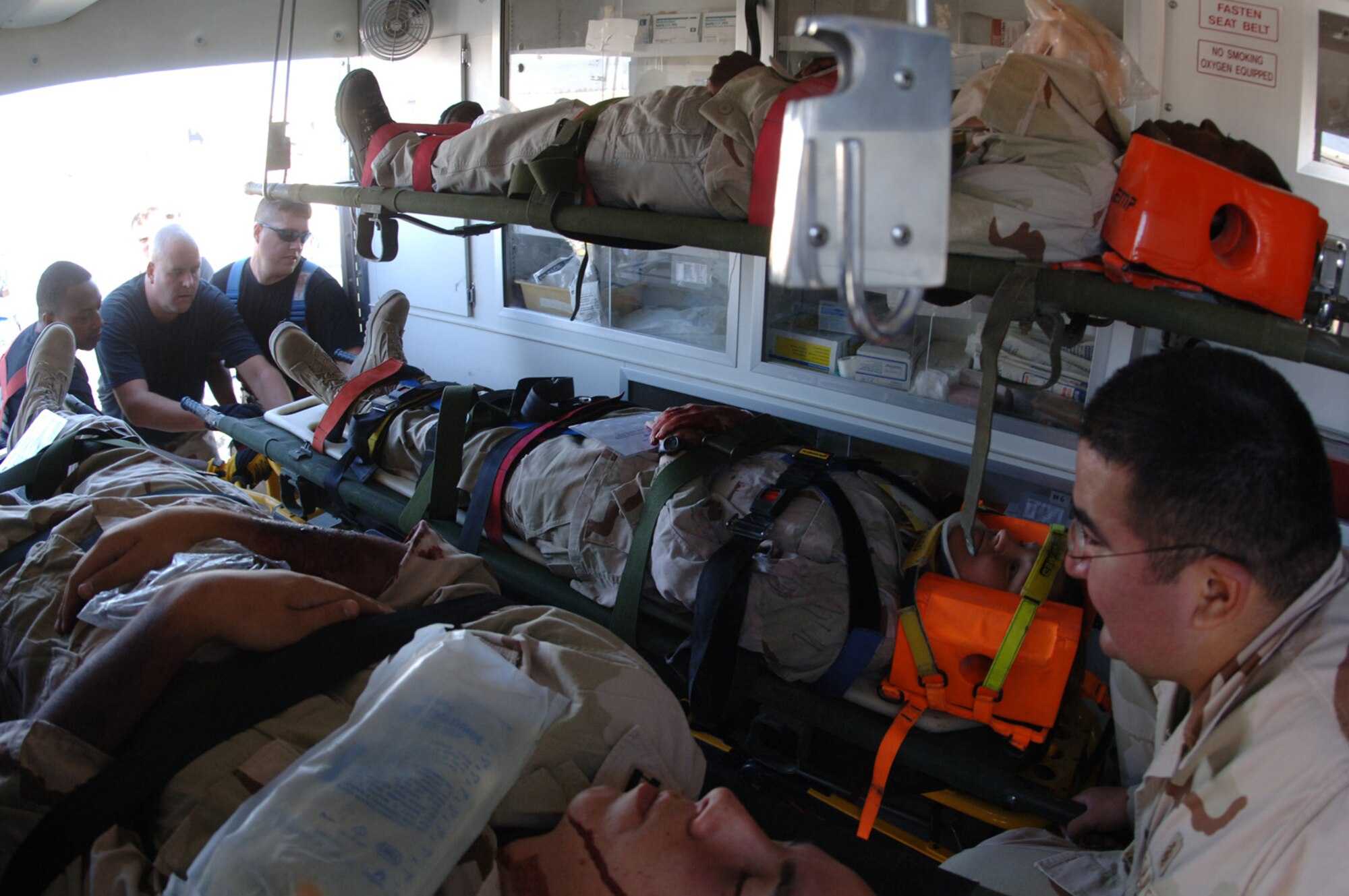 SOUTHWEST ASIA - Emergency services Airmen load victims in an ambulance following an aircraft incident during a Major Accident Response Exercise at a Southwest Asia air base Dec. 14.  (U. S. Air Force photo/Staff Sgt. Douglas Olsen)