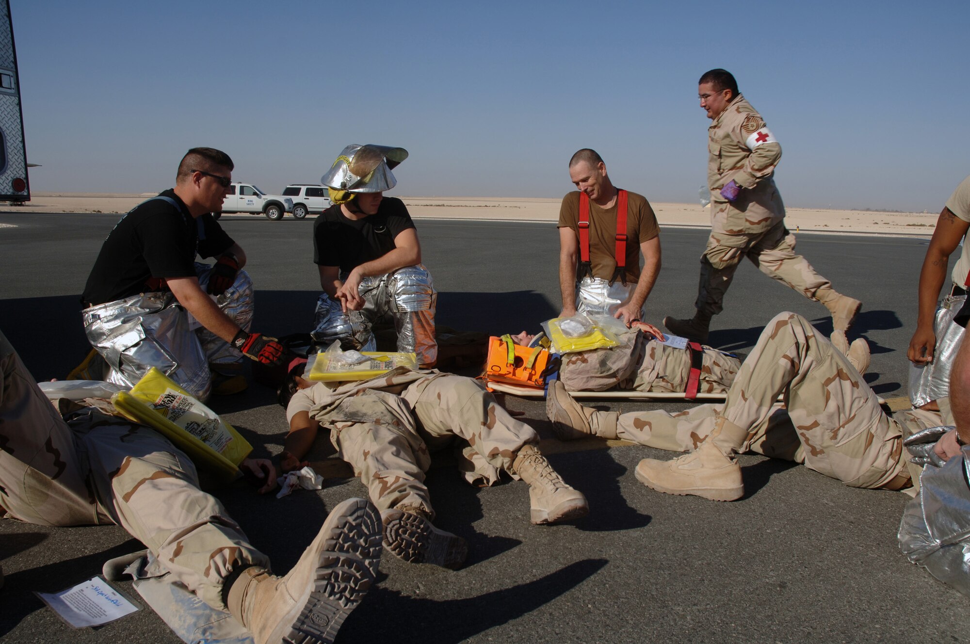 SOUTHWEST ASIA - Emergency services Airmen tend to victims following an aircraft incident during a Major Accident Response Exercise at a Southwest Asia air base Dec. 14.  (U. S. Air Force photo/Staff Sgt. Douglas Olsen)