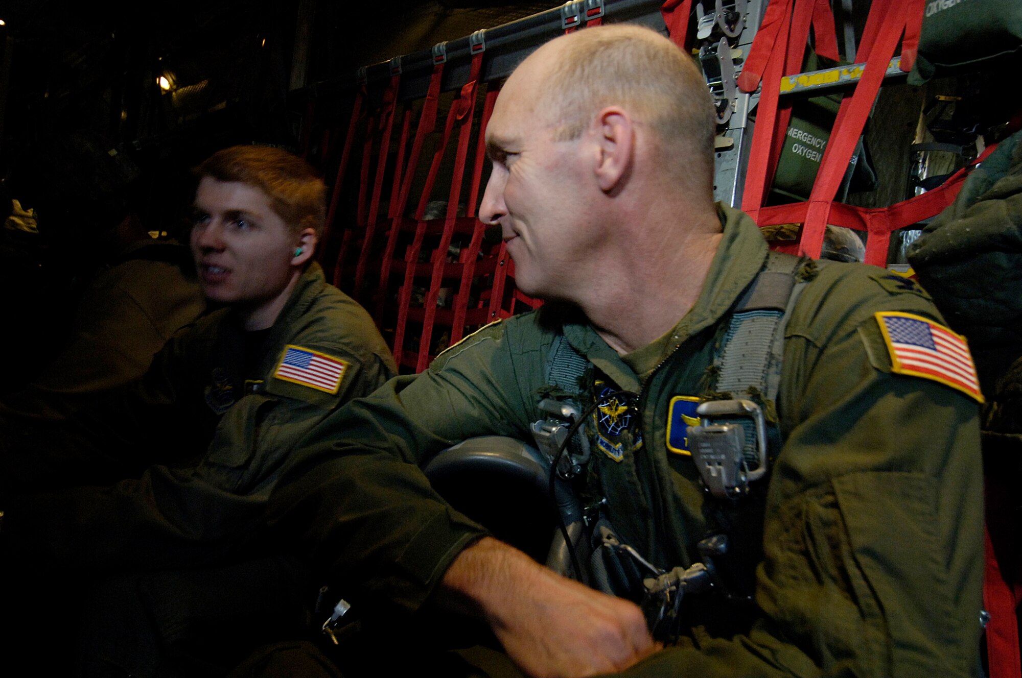 Col. Timothy Zadalis, 43rd Airlift Wing Commander, talks to an Airman while riding on one of Pope’s C-130’s during Operation Toy Drop Saturday. The event helped support the military and local community, collecting more than 1,400 toys for deserving families in the Fayetteville, N.C. area. (U.S. Air Force photo by Senior Airman Clay Lancaster)