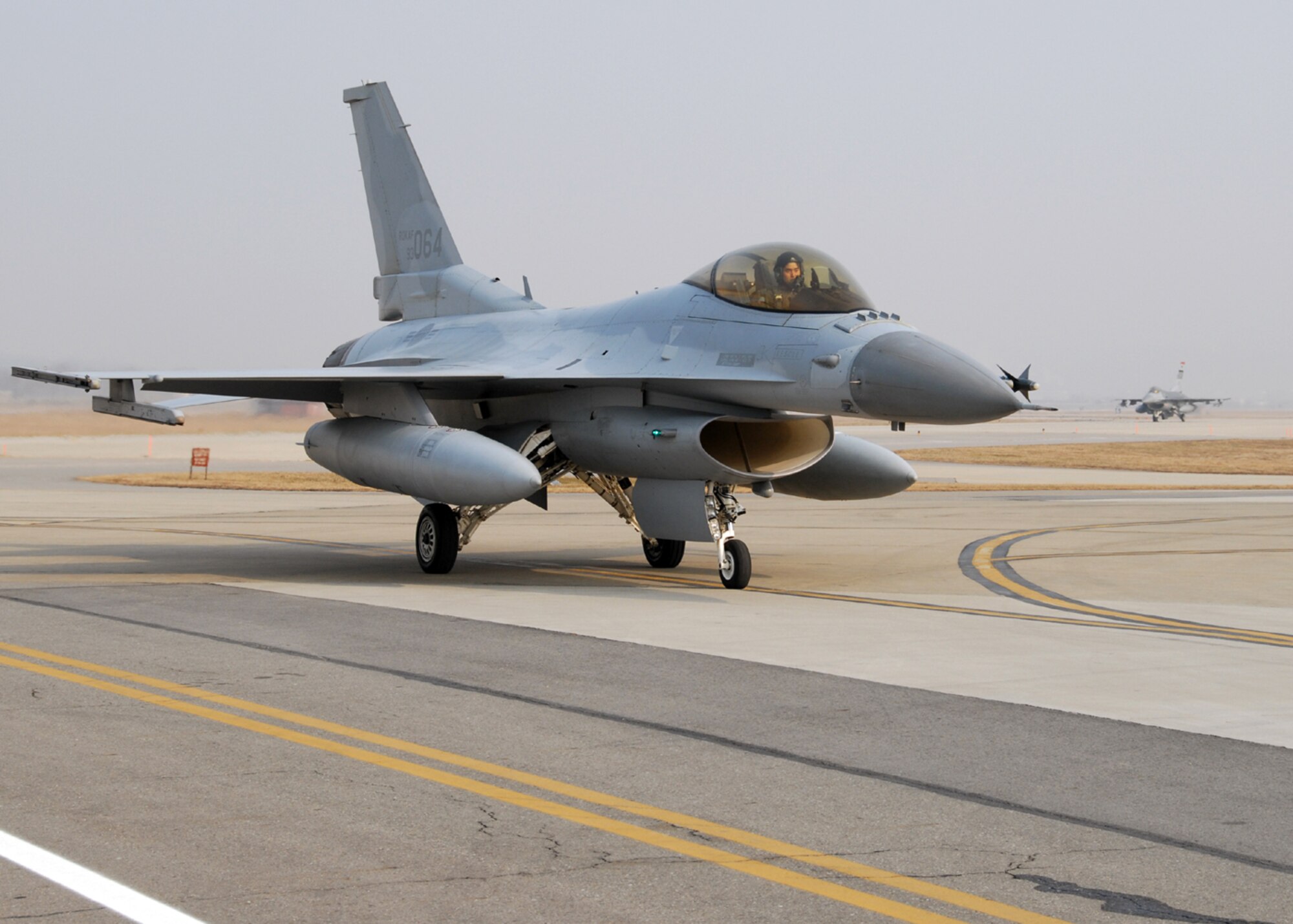 OSAN AIR BASE, Republic of Korea -- Captain Young-Kwon Ko a KF-16 Fighting Falcon pilot assigned to the 157th Tactical Fighter Squadron, Seosan Air Base, Republic of Korea Air Force, returns from his Buddy Wing sortie with pilots from the 36th Fighter Squadron during the Buddy Wing program 11 through 13 December.  The purpose of the Buddy Wing program is to exchange ideas, introduce tactics and improve interoperability between the U.S. and Republic of Korea Air Forces.  (U. S. Air Force photo by Senior Master Sgt Marvin Krause)