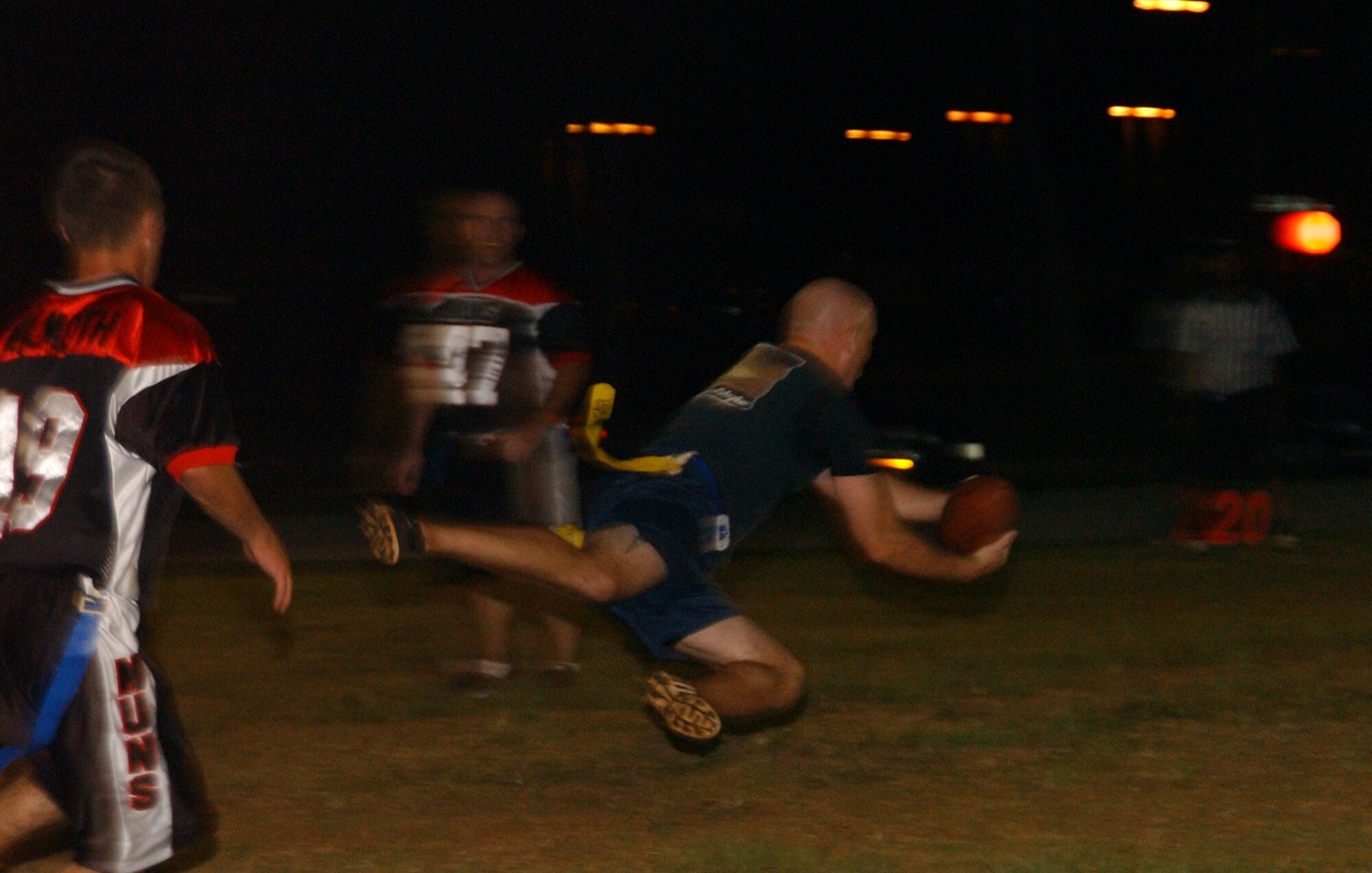 Capt. Brooks “Shank” Walters goes airborne and stretches out for this pass during the flag football game played here the evening of December 12. Captain Walters was all over the field that balmy evening as he played in key offensive and defensive positions. Both teams were well matched in speed and quickness; however, turnovers plagued the Tiger offense and they fell to their opponents with a final score of 28-8.