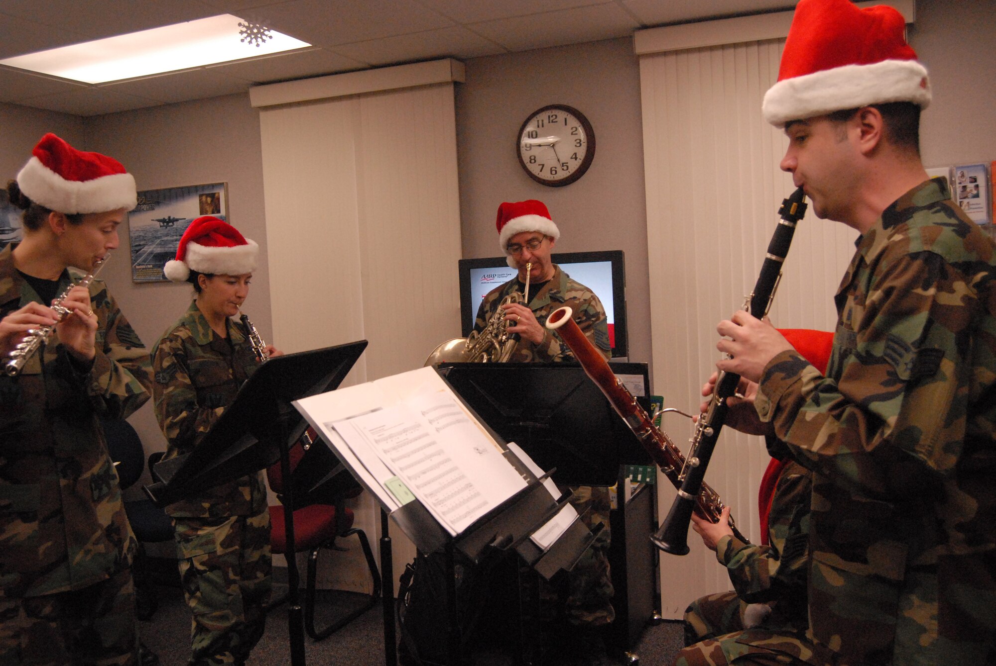 The Langley Winds perform for Pope Airmen during their visit on Dec. 13. The band visited several Pope units and surprised the Airman Leadership School graduation. (U.S. Air Force photo by SSgt. Cassandra Locke)