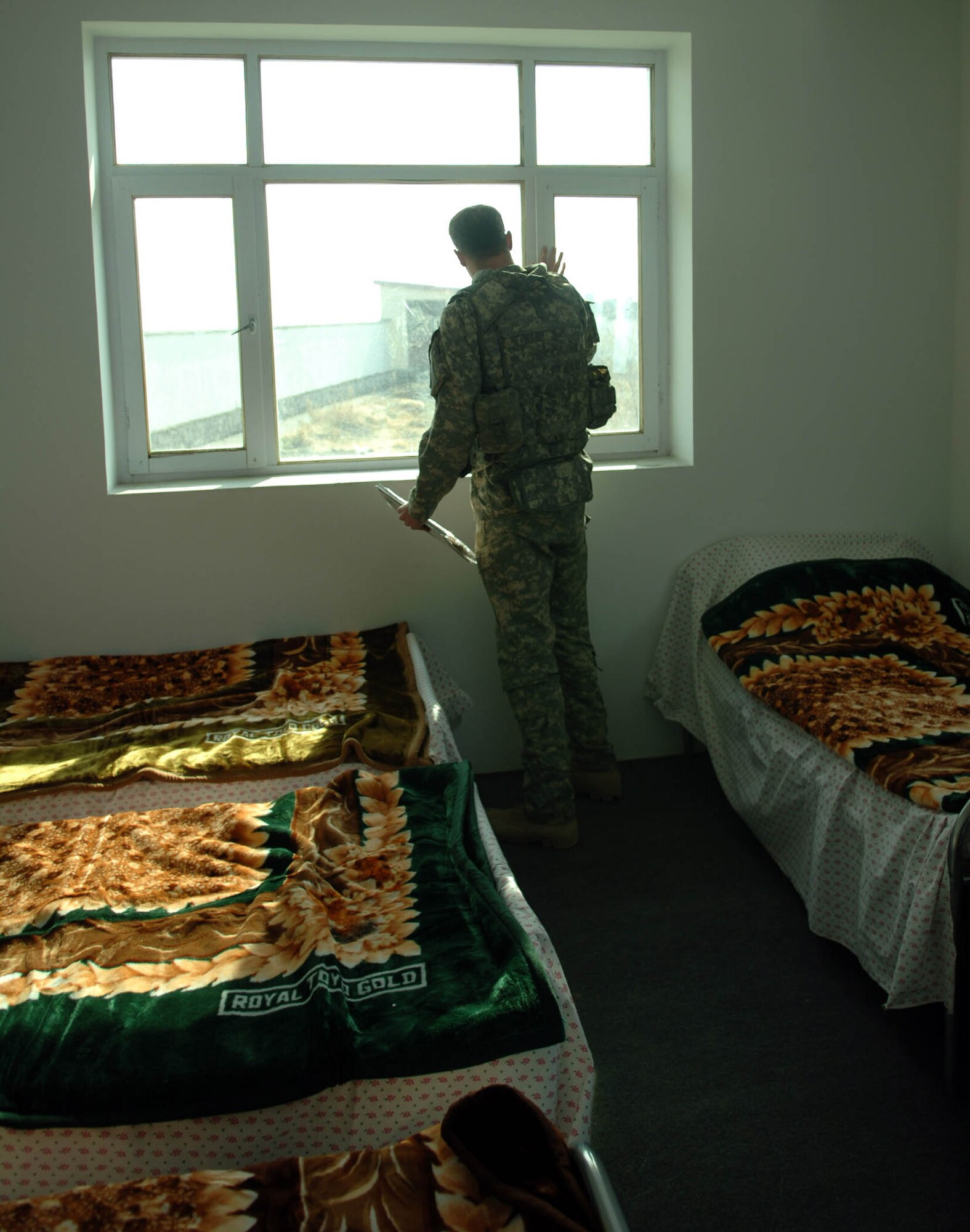 KAPISA PROVINCE, Afghanistan - Army Capt. Jordan Berry, the Bagram Provincial Reconstruction Team's Civil Affairs Team Leader for Kapisa Province, tours a newly-opened Afghan women's shelter here, Dec. 13.  The Bagram PRT provided more than $86 thousand in support of the project, which was completed by local contractors. (U.S. Air Force Photo by Staff Sgt. Mike Andriacco)