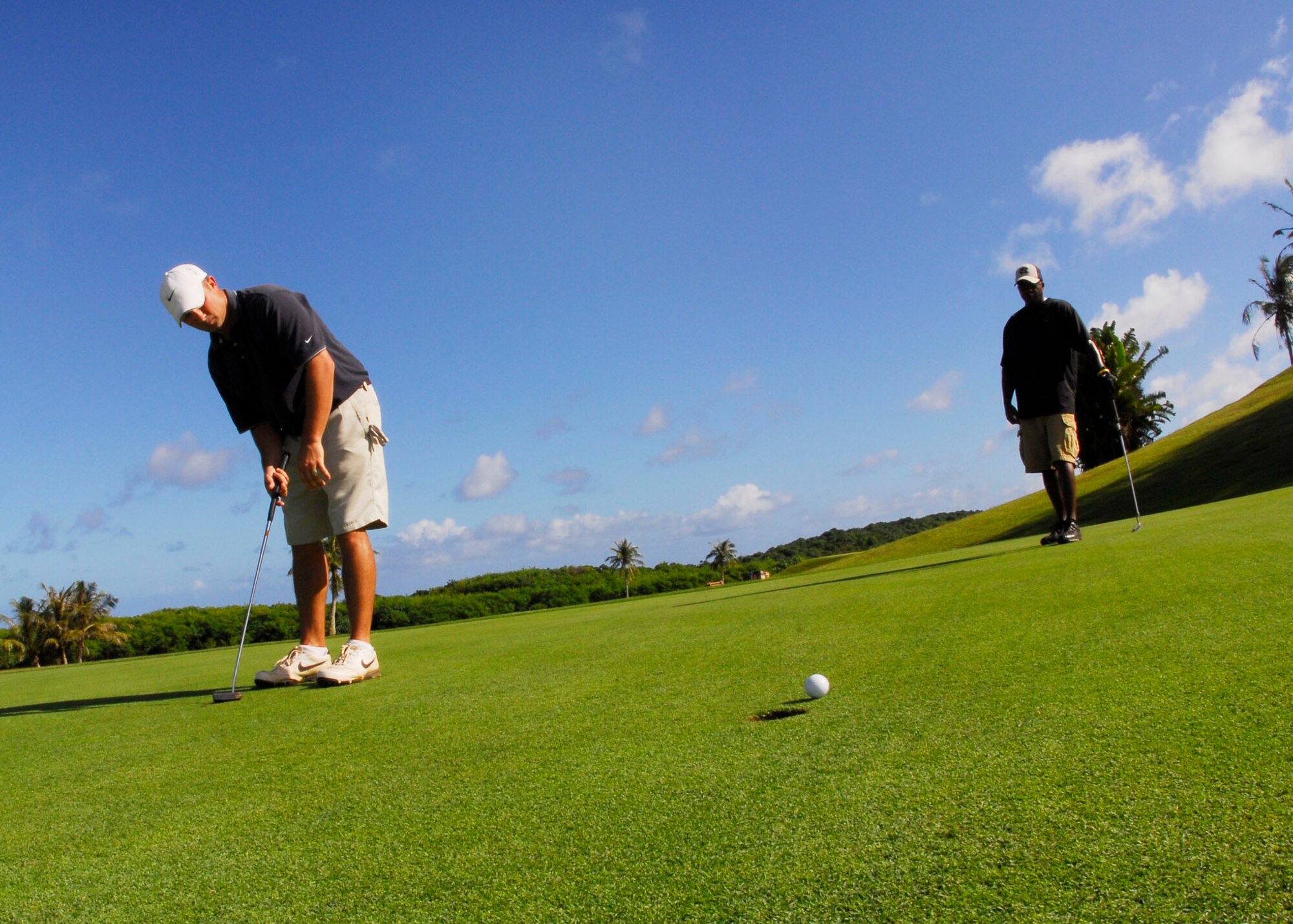 Senior Airman Matthew Vilsack, 36th Contracting Squadron, barely misses a putt during the golf portion of this year's Team Andersen Challenge Friday.  Several teams competed in the event held at Palm Tree Golf Course. (U.S. Air Force photo/Airman 1st Class Jonathan Hart)