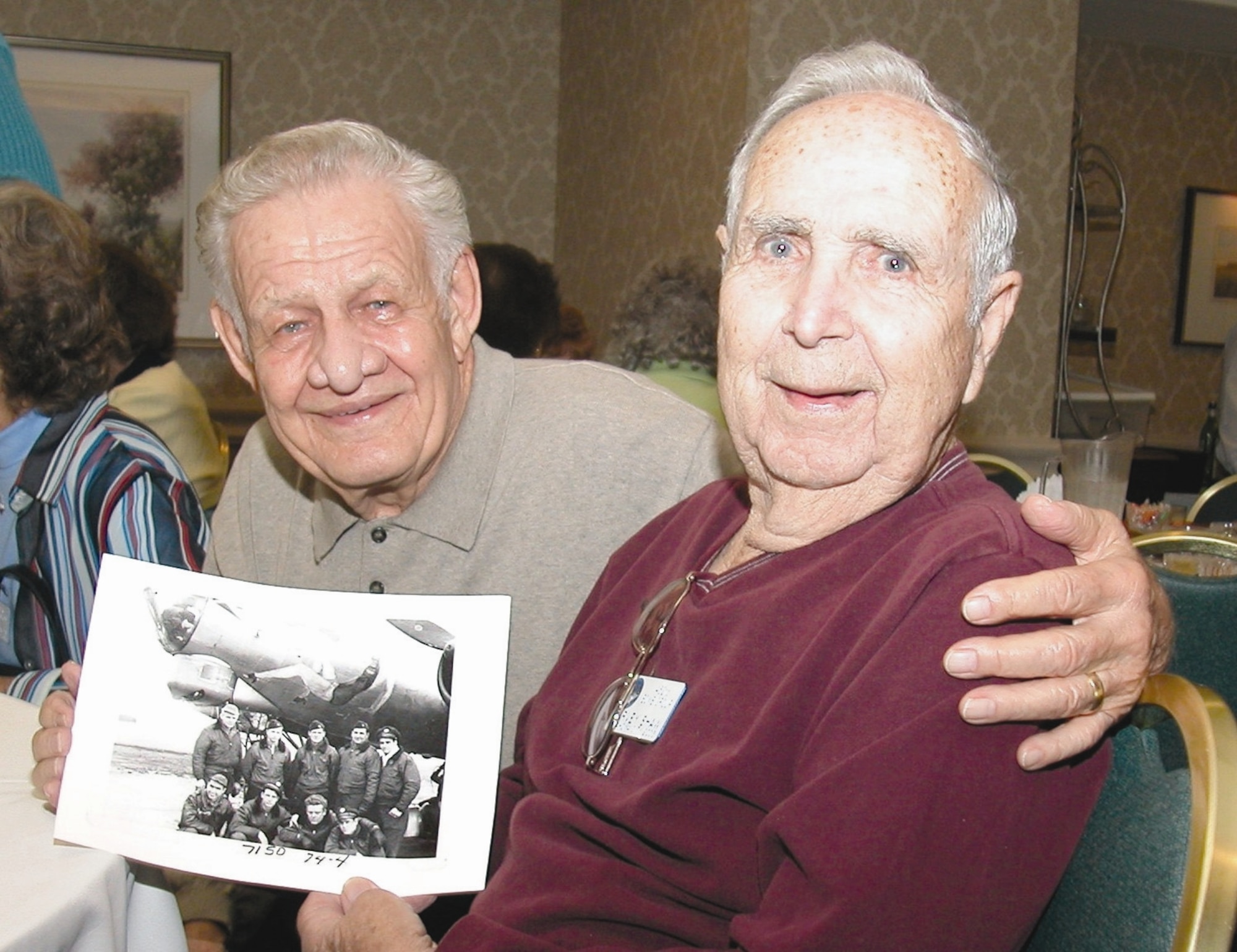 Technical Sgt. Ed Hinrichs, left, and Staff Sgt. Harvey A. Shaw share memories of their time as B-17 Flying Fortress gunners at a 452nd Bomb Group Association reunion. (U.S. Air Force photo by Senior Master Sgt. Matt Proietti)