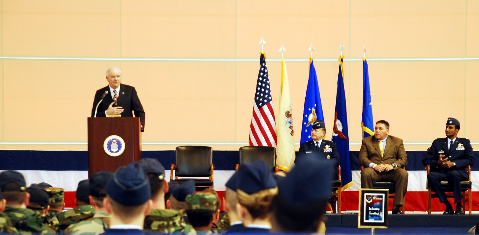 Air Force Secretary Michael W. Wynne speaks during the first C-17 Synthetic Fuel Transcontinental Flight ceremony here Dec. 17. Left to right, Maj. Gen. Frederick Roggero, director of air, space and information operations, Kevin Billings, deputy assistant secretary of the Air Force for environment, safety and health, and Col. Balan Ayyar, 305th Air Mobility Wing commander, were also guest speakers during the event. The aircraft from McChord AFB, Wash., powered by a 50/50 blend of synthetic fuel and JP-8, landed here on the anniversary of the Wright Brothers’ first flight, 104 years ago. The transcontinental flight was a demonstration of the fuel being used to certify the entire Air Force fleet including ground vehicles. (U.S. Air Force courtesy photo)   