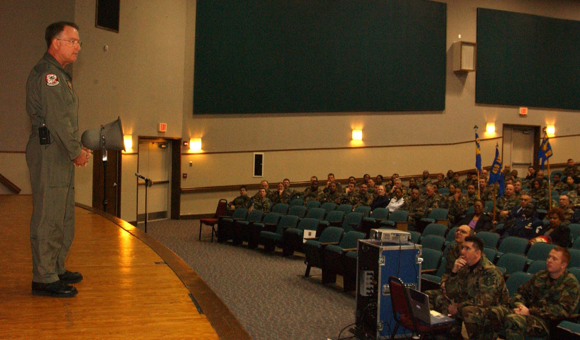 ANDREWS AIR FORCE BASE, Md. -- Lt. Gen. John A. Bradley, commander of Air Force Reserve Command, briefs members of the 459th Air Refueling Wing during the quarterly commander's call Dec. 8. General Bradley attended the call to recognize star performers, chat with Airmen and discuss topics relevant to the AFRC. (U.S. Air Force photo/Staff Sgt. Amaani Lyle)