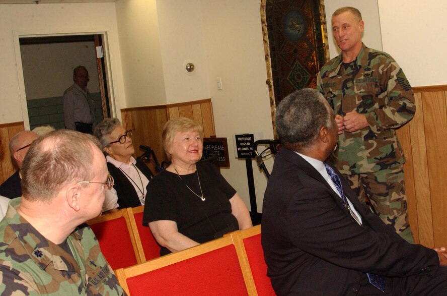 WASHINGTON, D.C. -- Master Sgt. Stephen Bedell, 459th Logistics Readiness Flight, talks to Armed Forces Retirement Home residents Dec. 14 about his recent deployment. Wing members visited the home to thank veterans for their service and distribute gifts for the holiday season. (U.S. Air Force photo/Staff Sgt. Amaani Lyle)