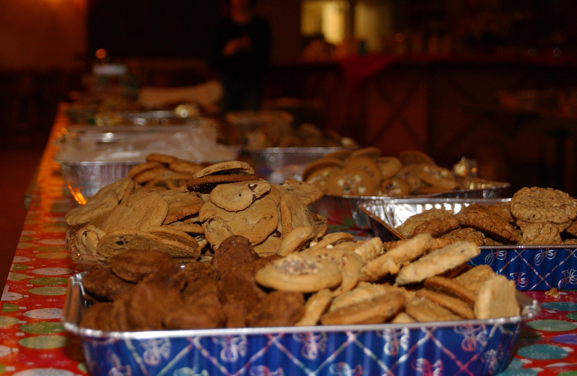 EIELSON AIR FORCE BASE, Alaska--Dozens of homemade cookies sit on an assembly table ready to be packaged Dec. 14, 2007 at the Yukon Club. Operation Cookie Crunch is a yearly event organized and sponsored by the Eielson Officer's Spouses Club, where sometimes more than 550 dozen homemade cookies are donated, boxed and delivered to single Airmen living in the dormitories as a holiday gesture. (U.S. Air Force photo by Airman 1st Class Nora Anton)