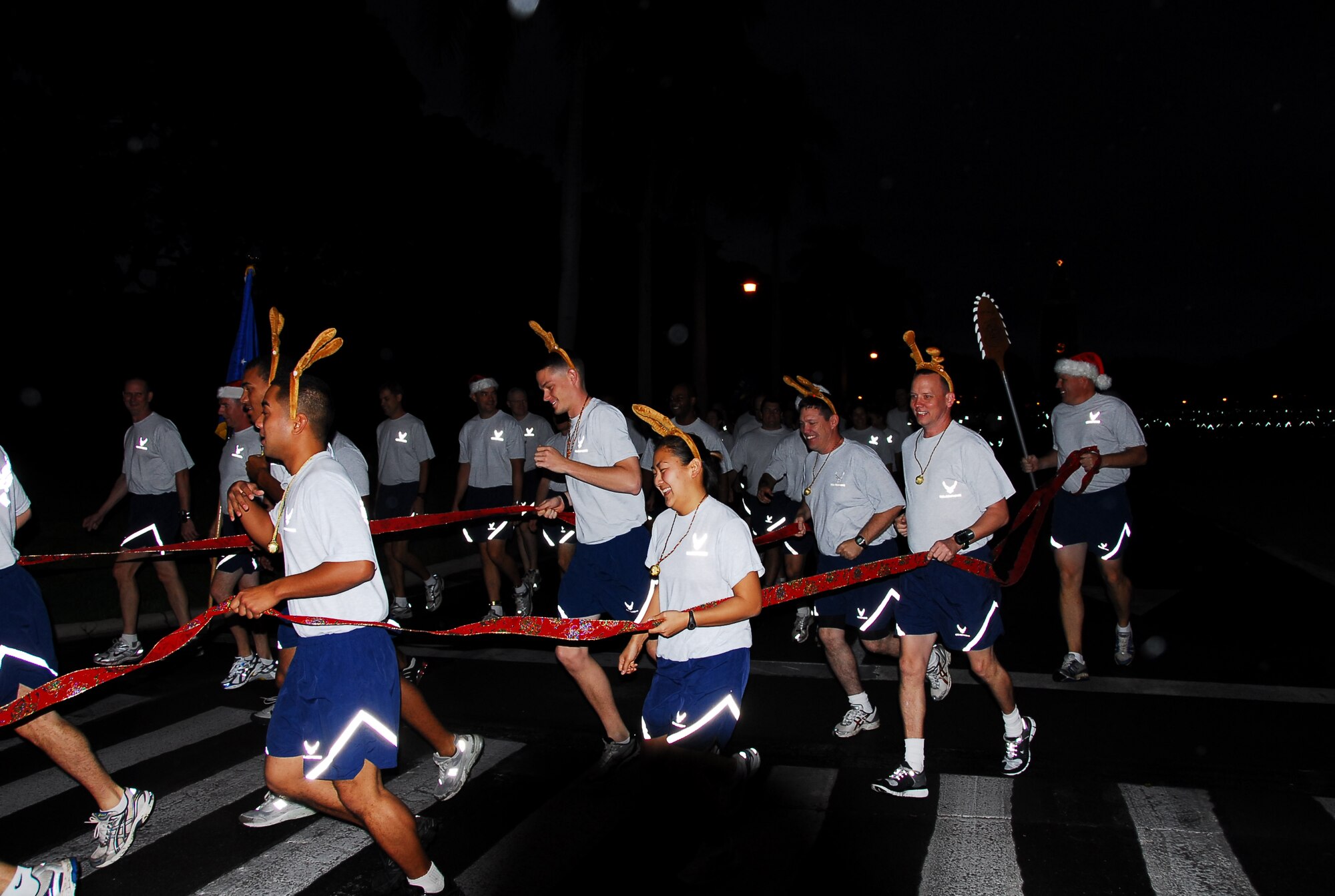 Col. Lipinski, 15th Maintenance Group commander, and members of the 15th Maintenance Group, round the first corner during the Team Hickam Warrior Run, Friday morning. Photo by Ed Foster